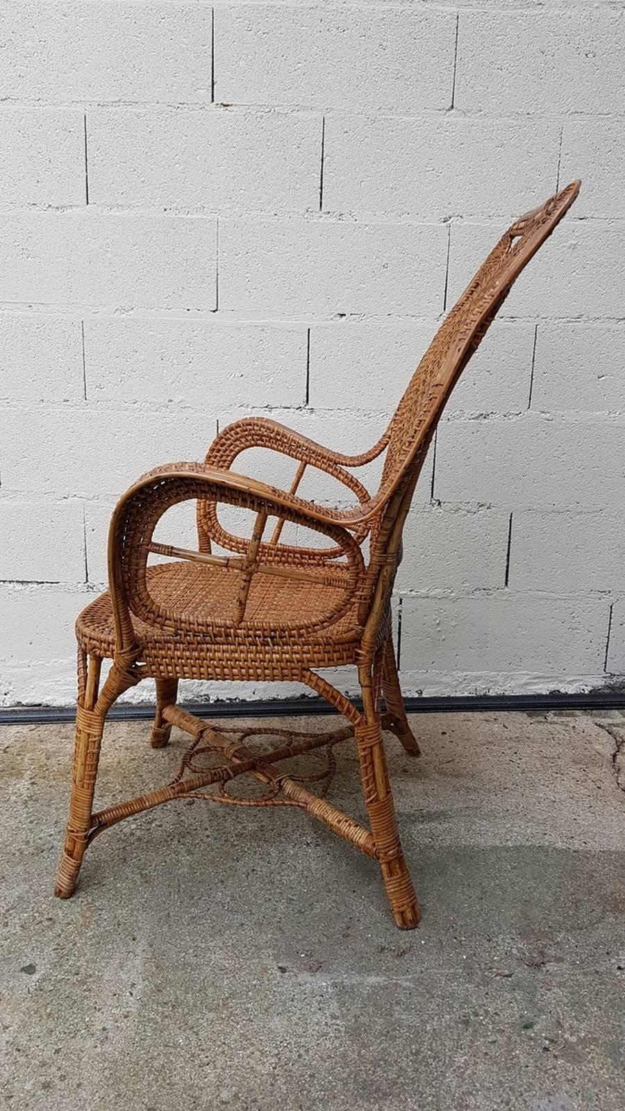 Elegant rattan armchair realized by the Perret & Vibert Manufactory in France. The originality of this armchair comes from of its chair’s back and also from the armrests figuring a cross.

The taste for exoticism during the Second Empire explains