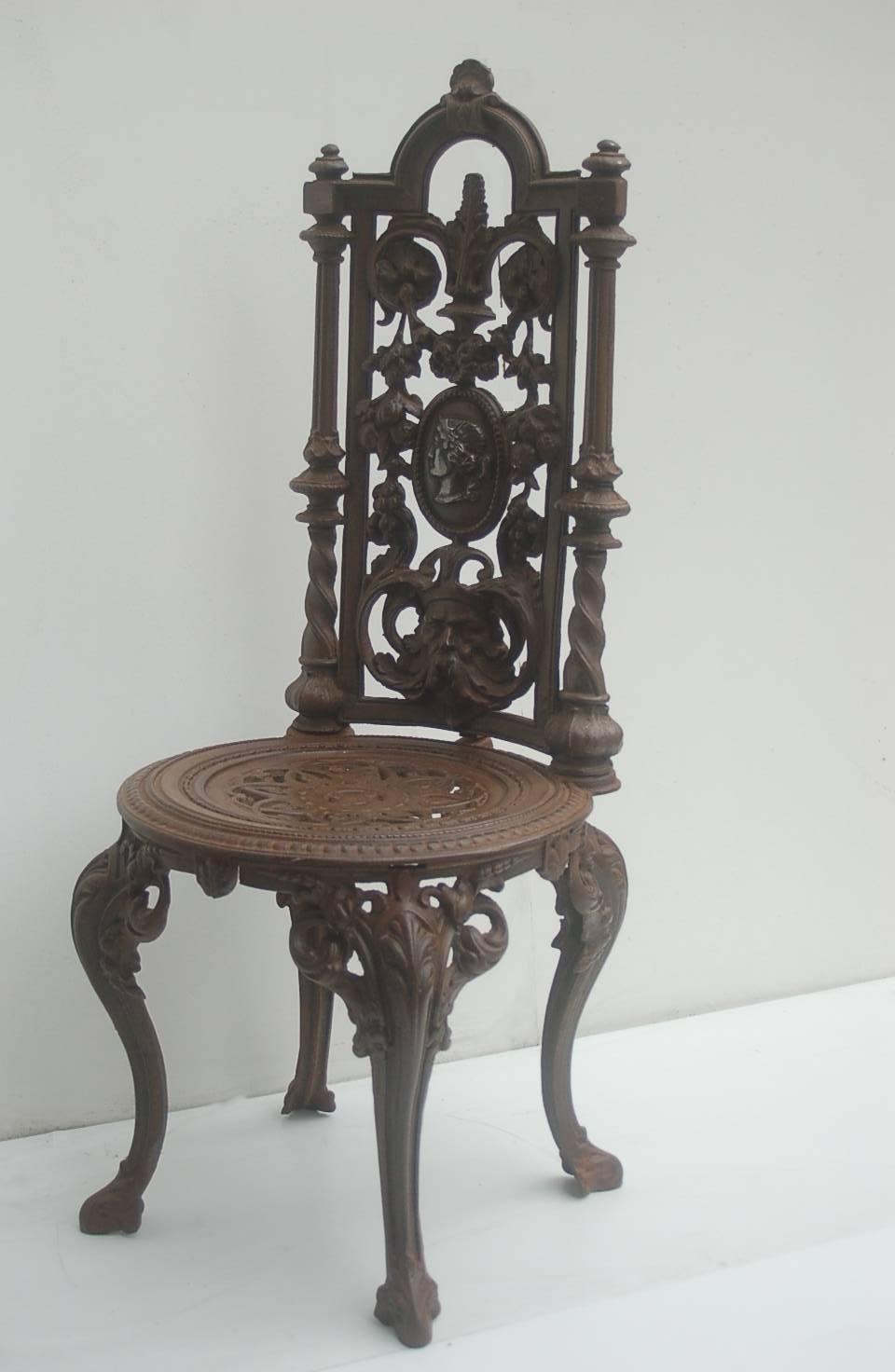 This rare chair of Napoleon III period is quite representative of a time when garden furniture were made of iron. This one has a perforated decoration. The seat is decorated with an interlaced rosette motif. The backrest is decorated with fruits,