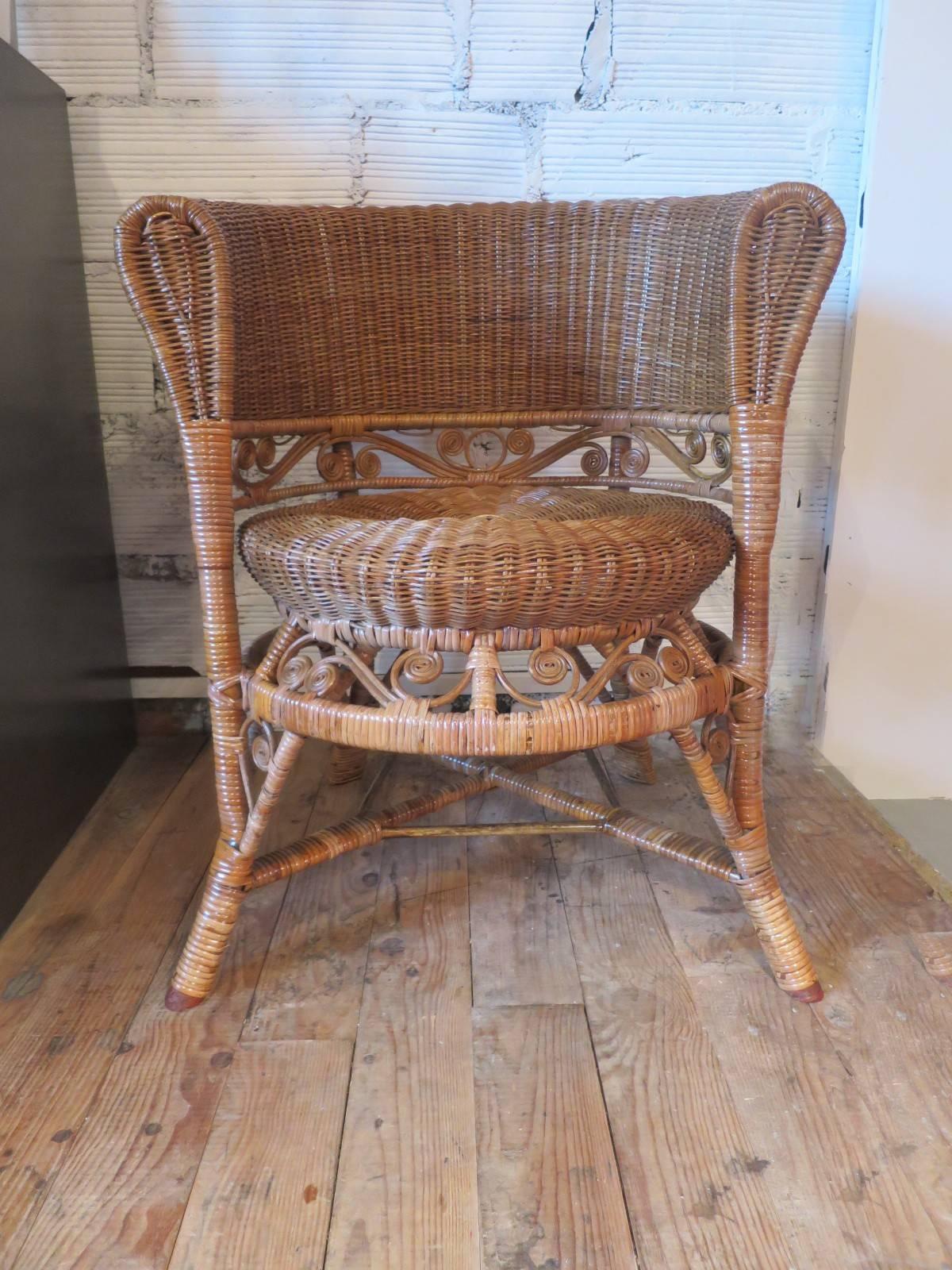 Nice and charming false pair of two rattan armchairs. The details of the decoration refer to the style of Heywood Brothers & Wakefield Company. They are very comfortable, strong and in a very good condition.

Measures: Diameter of the seat 46 and