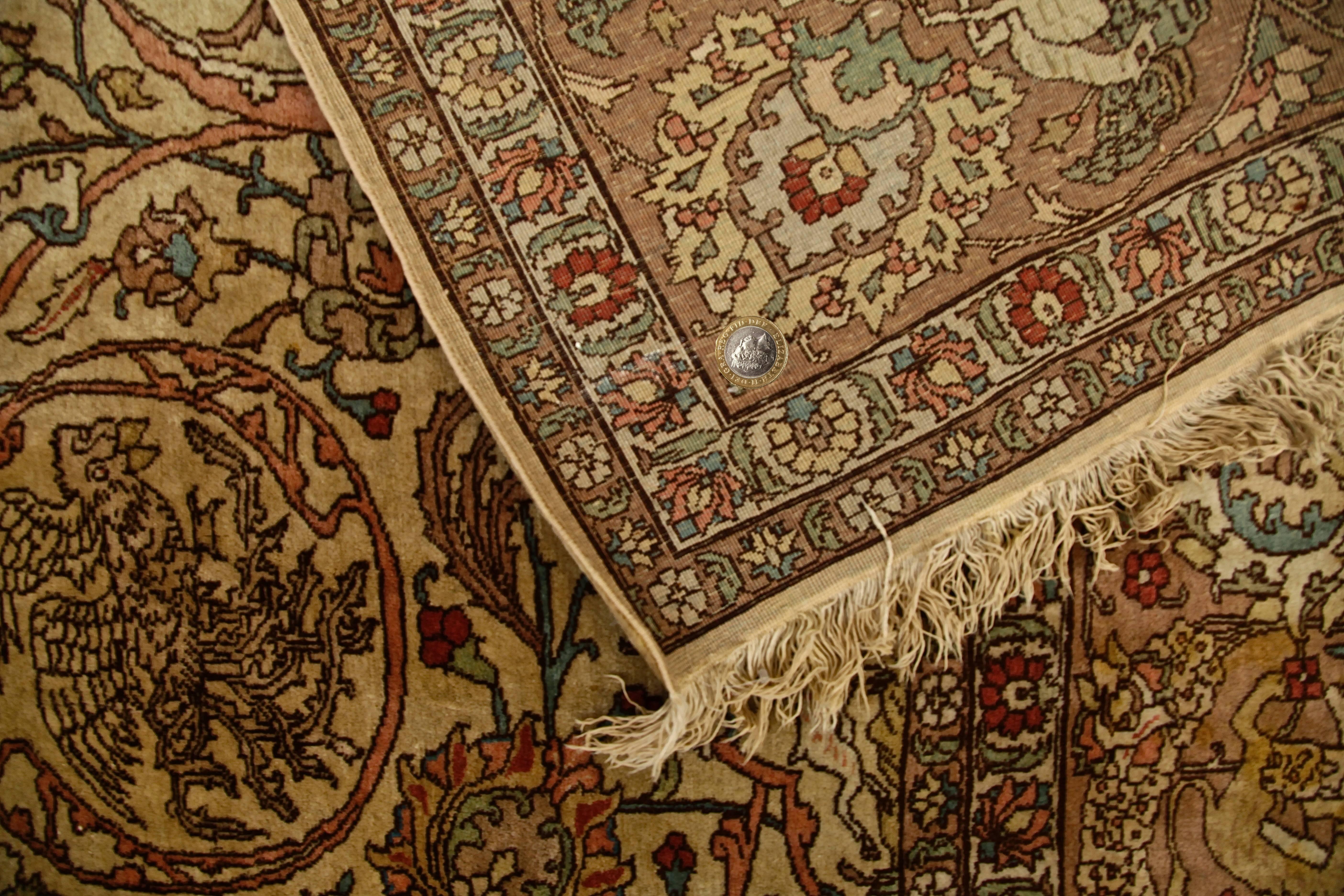 Antique Persian Tabriz carpet, mid-20th century. Measures: 298 x 393cm.

Tabriz carpet as they lead the viewer's eye on a seemingly never-ending journey along every twist and turn, earthy brown, steel grey in the surrounding borders. Delicate