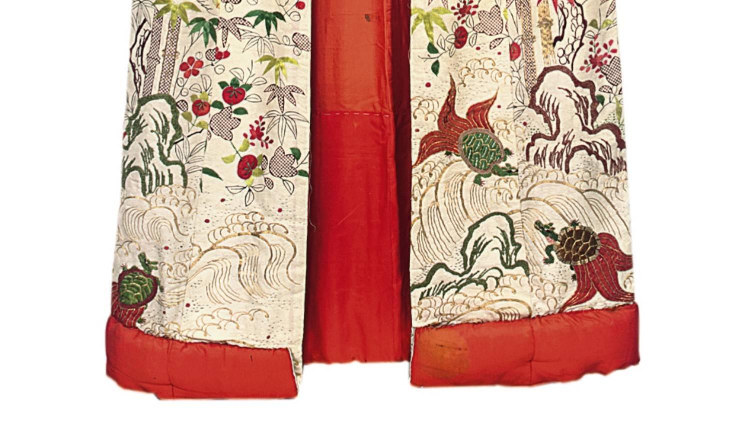 A furisode [wedding kimono],
Edo period, (Early 20th century).
Printed and embroidered with Ishibori leaves and red embroidered
plum blossom, with padded hem and long sleeves. Measures: 130 x 160cm.
 