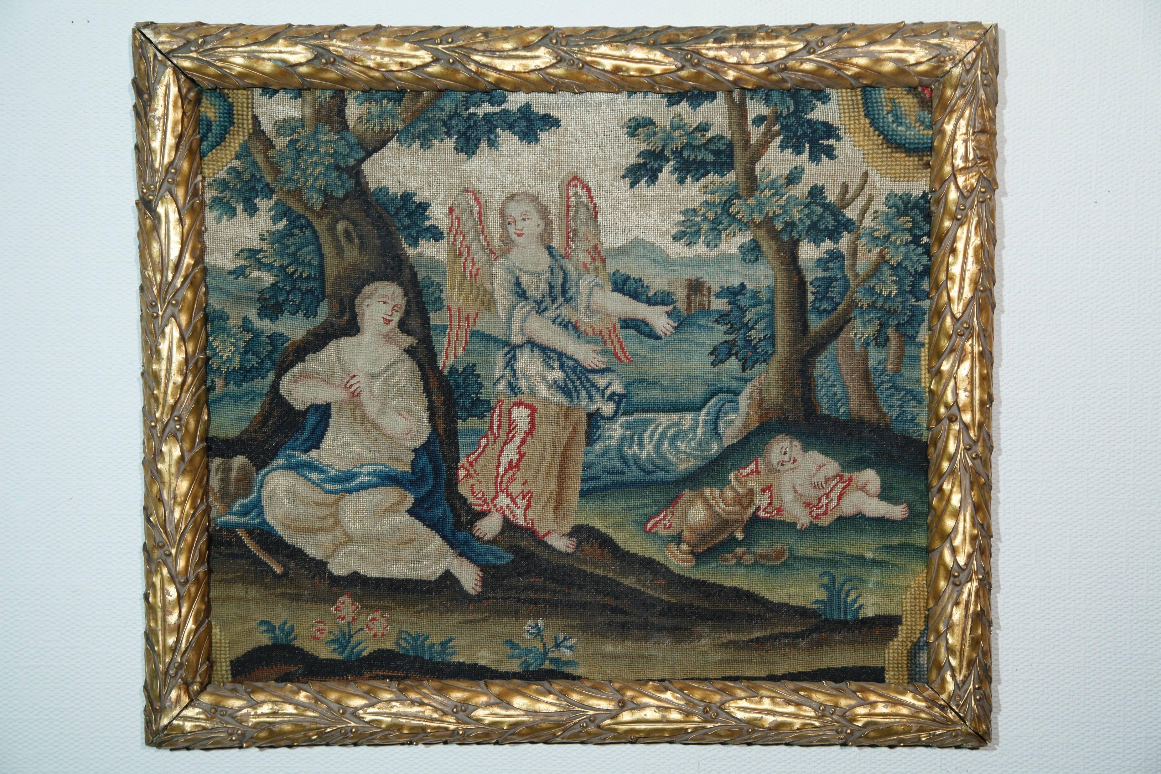 A pair of very fine needlepoint, worked in colored silks and wool, with raised faces and the field worked with trees, animals, river. Framed size 53 x 45 cm, circa 1900.
