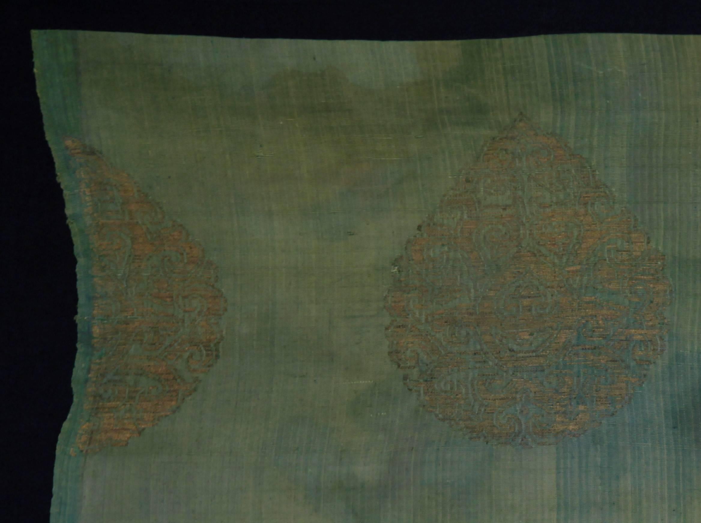 Chinese silk brocade
Measures: 48 x 55cm
13th-15th century
    
Chinese brocade, gilded paper supplementary weft on silk, Jin dynasty 1127–1279, this lovely and rare textile is from a small and distinctive group of textiles, usually squares,