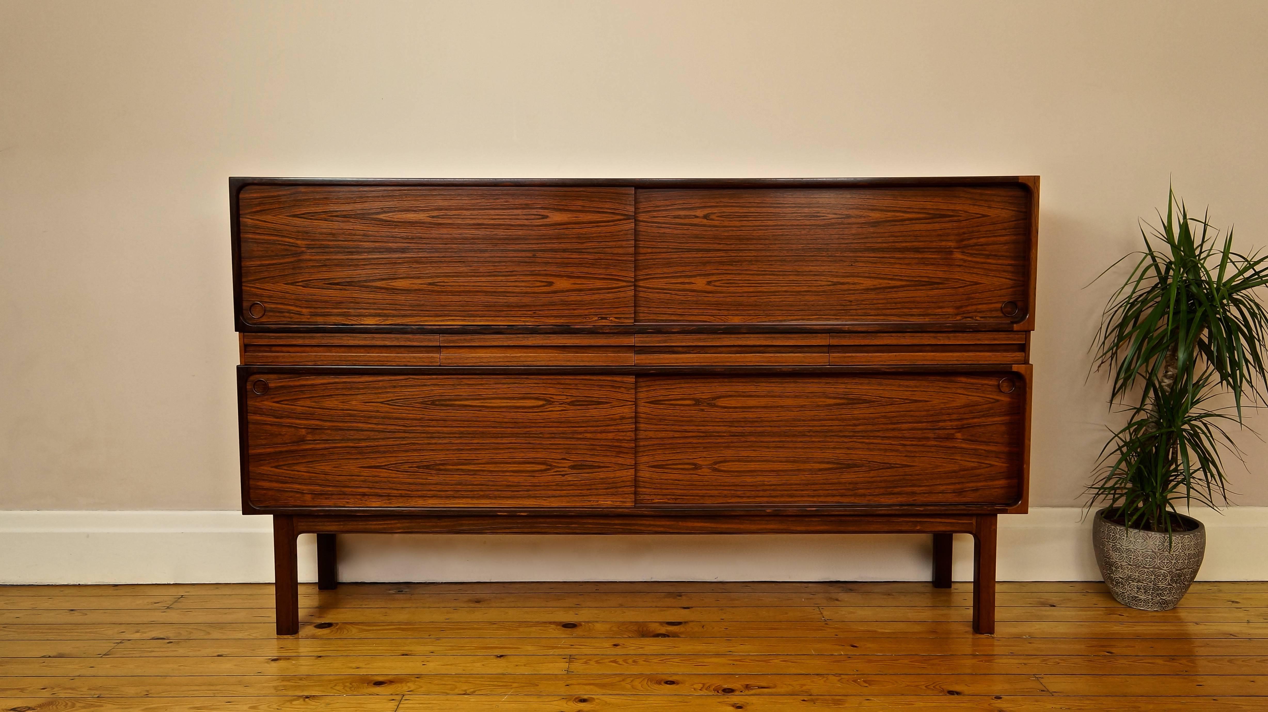 Vintage Danish rosewood two-tier sideboard. 
Designer: Sigfred Omann.
Manufacturer: Olholm Mobler, Denmark.

An incredibly rare sideboard by Sigfred Omann for Olholm Mobler, model 233. 

Amazing Brazilian Rio rosewood throughout, with four