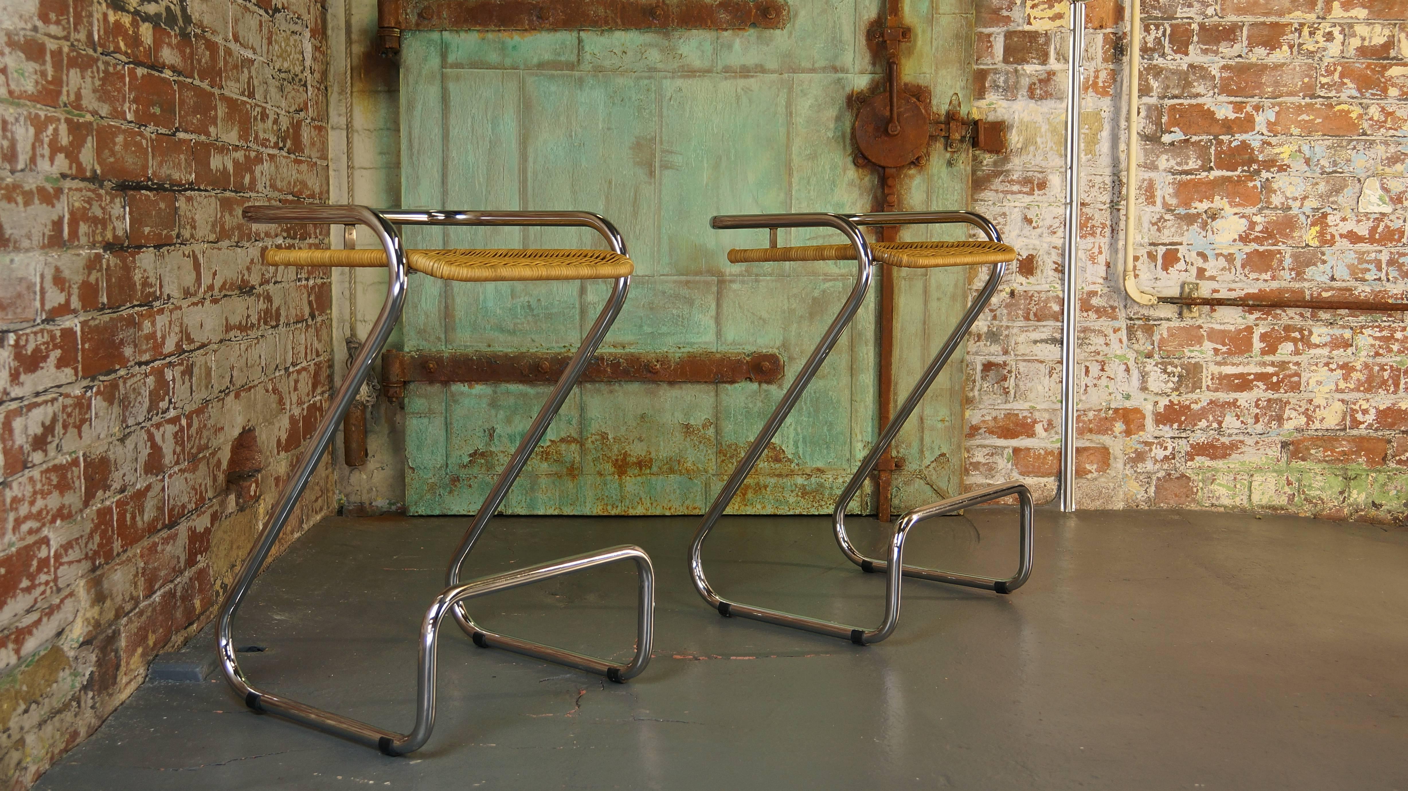 Pair of 1970s Vintage Italian chrome and wicker bar stools or counter stools.
Attr: Mariani

High quality, heavy gauge chrome-plated steel tubing with caned seats.

Very elegant modernist design and very comfortable.

H - 72cm
W - 47cm
D -
