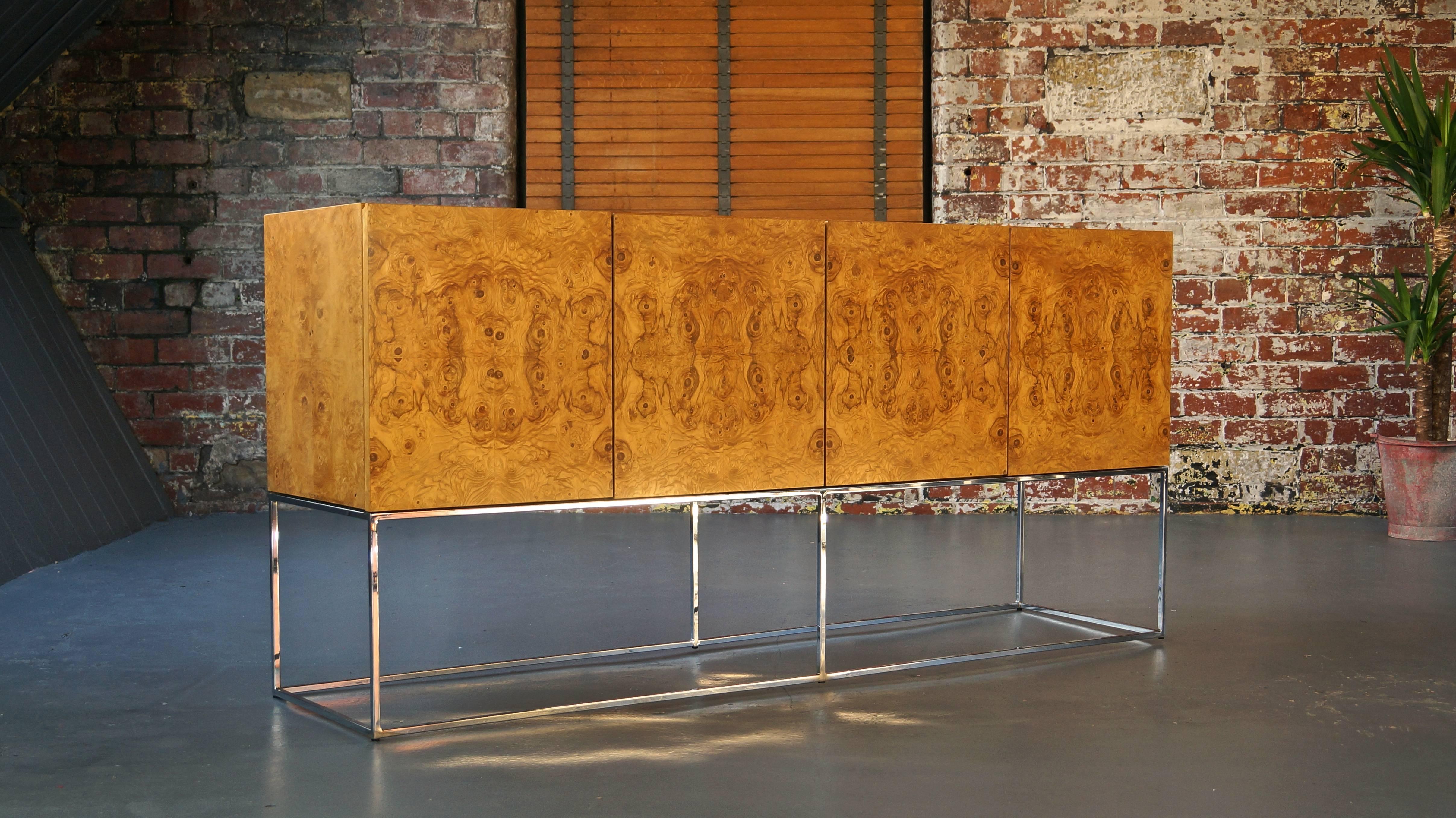 Beautiful Milo Baughman sideboard / credenza for Thayer Coggin

Book matched burl wood, resting on elegantly slim chromed steel base. 

This piece is a beautiful Mid-Century Modern 1970s statement piece from one of the masters of American