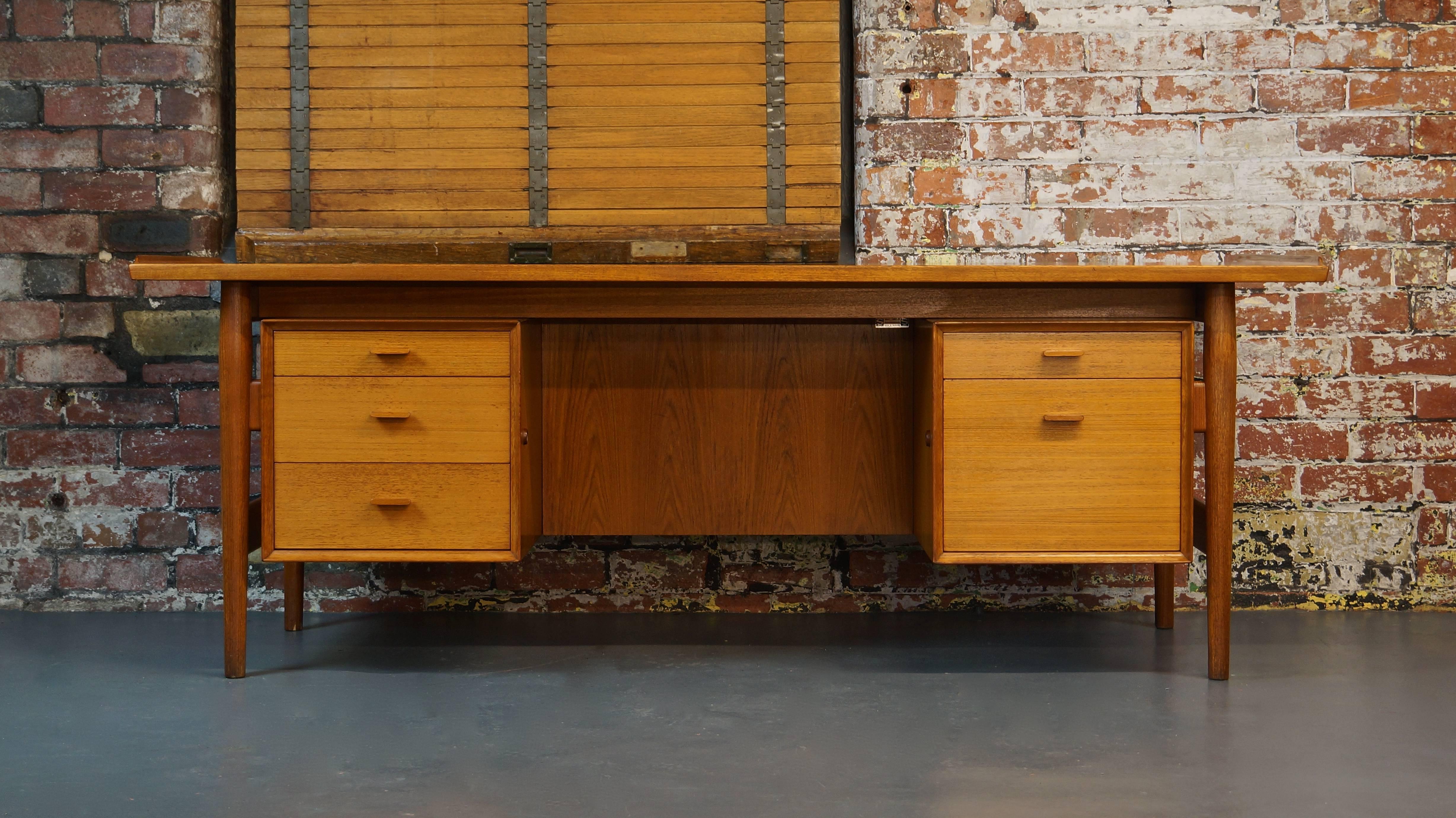 Model 207 Danish Teak Desk 

Designer - Arne Vodder 
Maker - Sibast Denmark 
Circa 1960's

Rare Large Size at 204,5cm wide

Refinishing / Restoration services available at additional cost if required to make this beautiful piece look like new