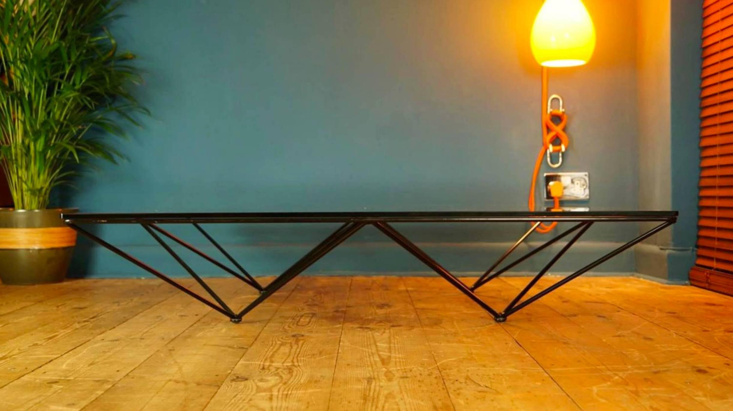 Genuine B&B Italia Alanda table 

Designer and manufacturer: Paolo Piva for B&B Italia 
Designed: 1980s.

Highly sought after authentic vintage coffee table designed by Paolo Piva for B&B Italia in 1981. 

Black powder coated steel frame with a very