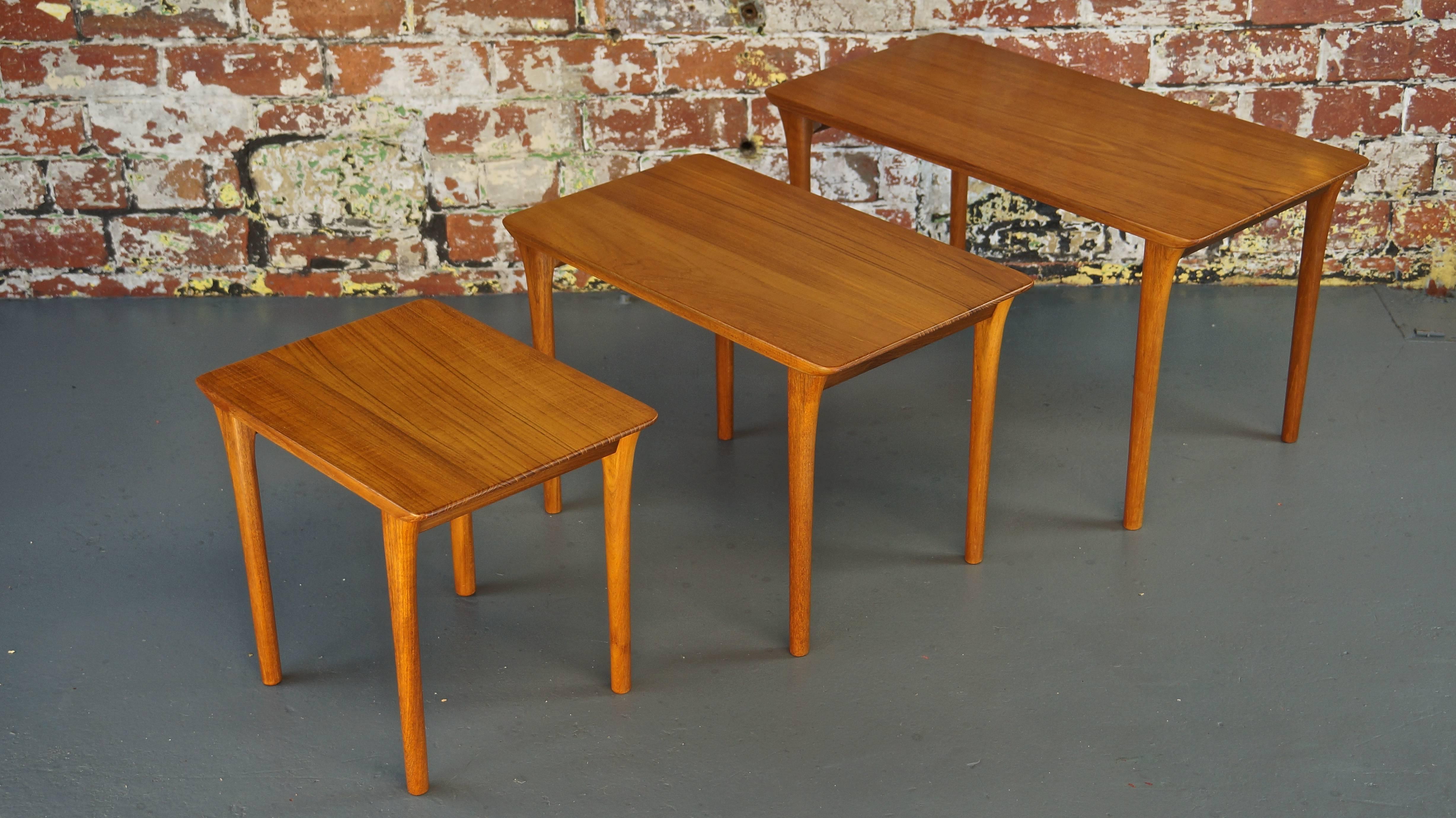 Rare Mid-Century Vintage solid teak danish nest of three tables or end tables.

An elegant teak nest of tables of very high quality being entirely constructed from solid teak which is incredibly rare! 

The organic shape of the solid teak legs