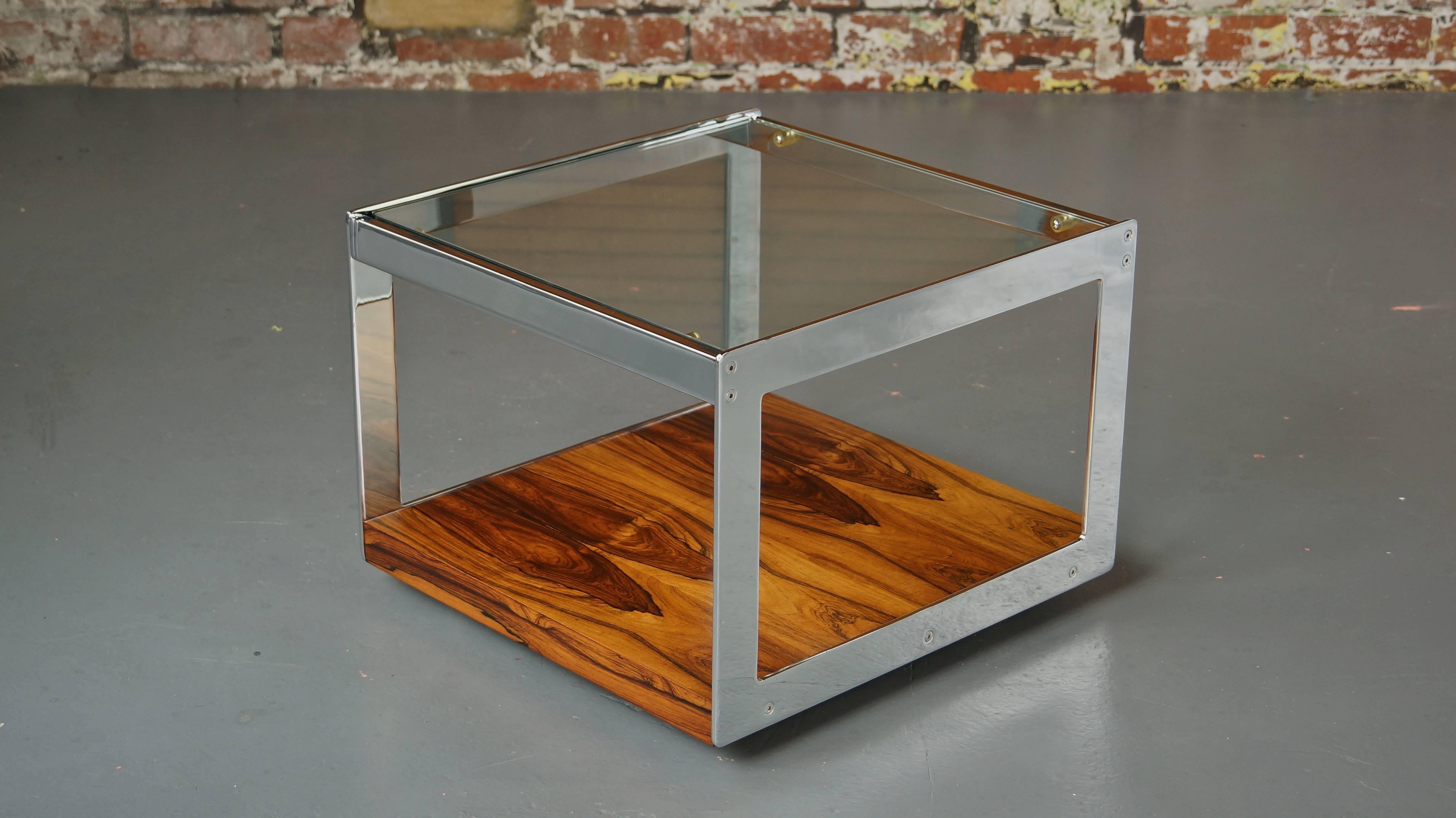 Rare 1970s chrome and rosewood coffee, side or end table
Designed by Richard Young for Merrow Associates, England

Exceptionally rare and exceedingly high quality piece offered in outstanding condition throughout. By one of the best design houses