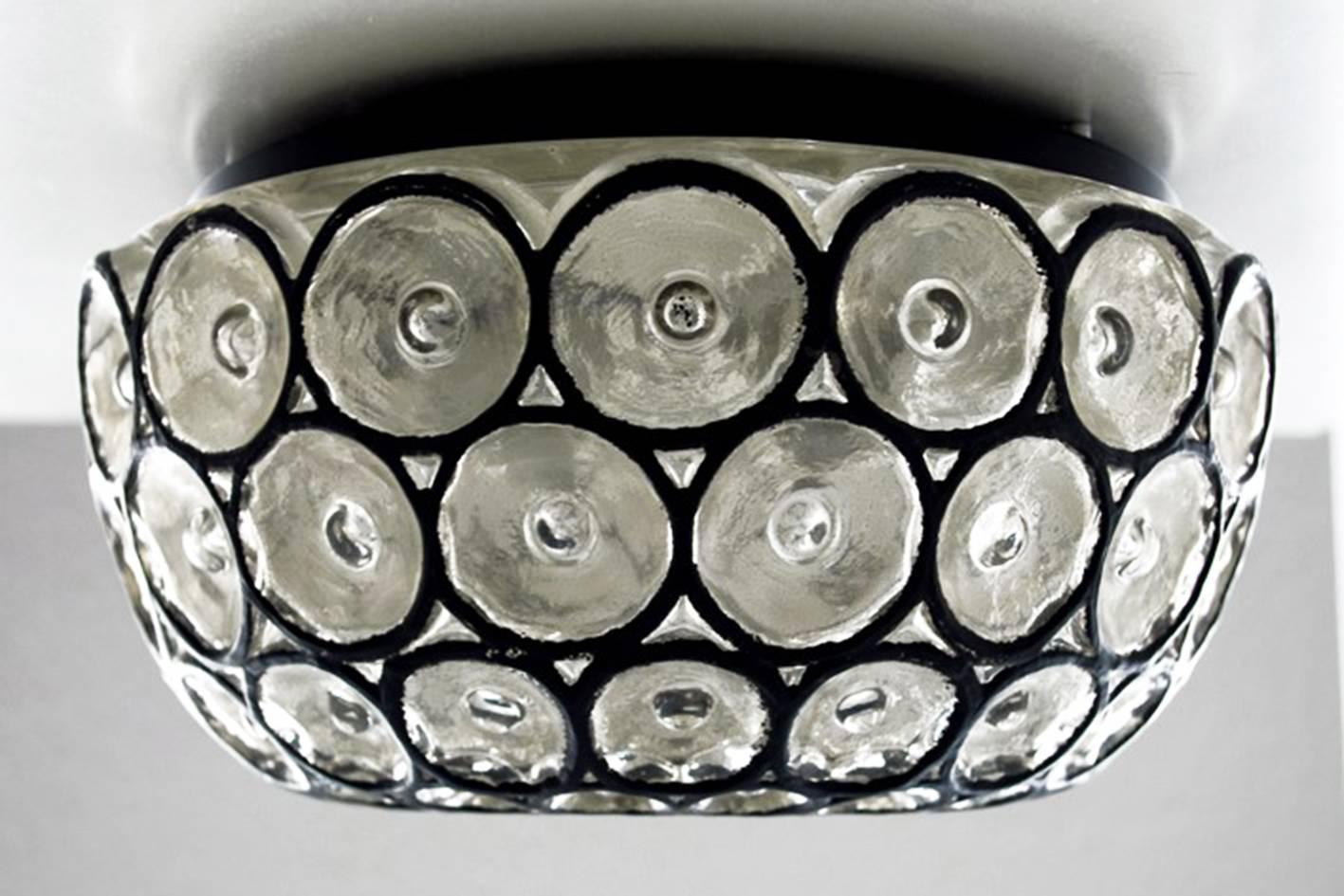 Rare Iron and glass flush mount by Limburg. 
Germany, 1960s
Measures: Diameter 10 in, height 6 in, sockets: 1x E27.

Or smaller version available
Measures: Diameter 7.9 in, height 4.3 in, sockets: 1x E27.