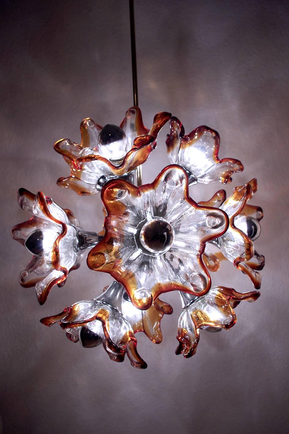 Beautiful vintage Mazzega-Murano chandelier with twelve large blown glass flowers.
Italy, 1960s. 
Lamp sockets: 12.