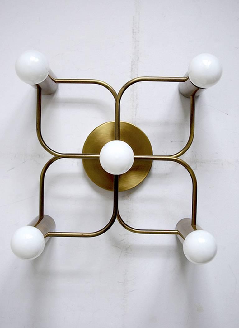Pair of sculptural Sciolari style ceiling or wall flush mount by Leola,
Germany, 1960s.
Measures: Height 13.8 in, width 13.8 in, depth 7 in 
Brushed brass version.
 