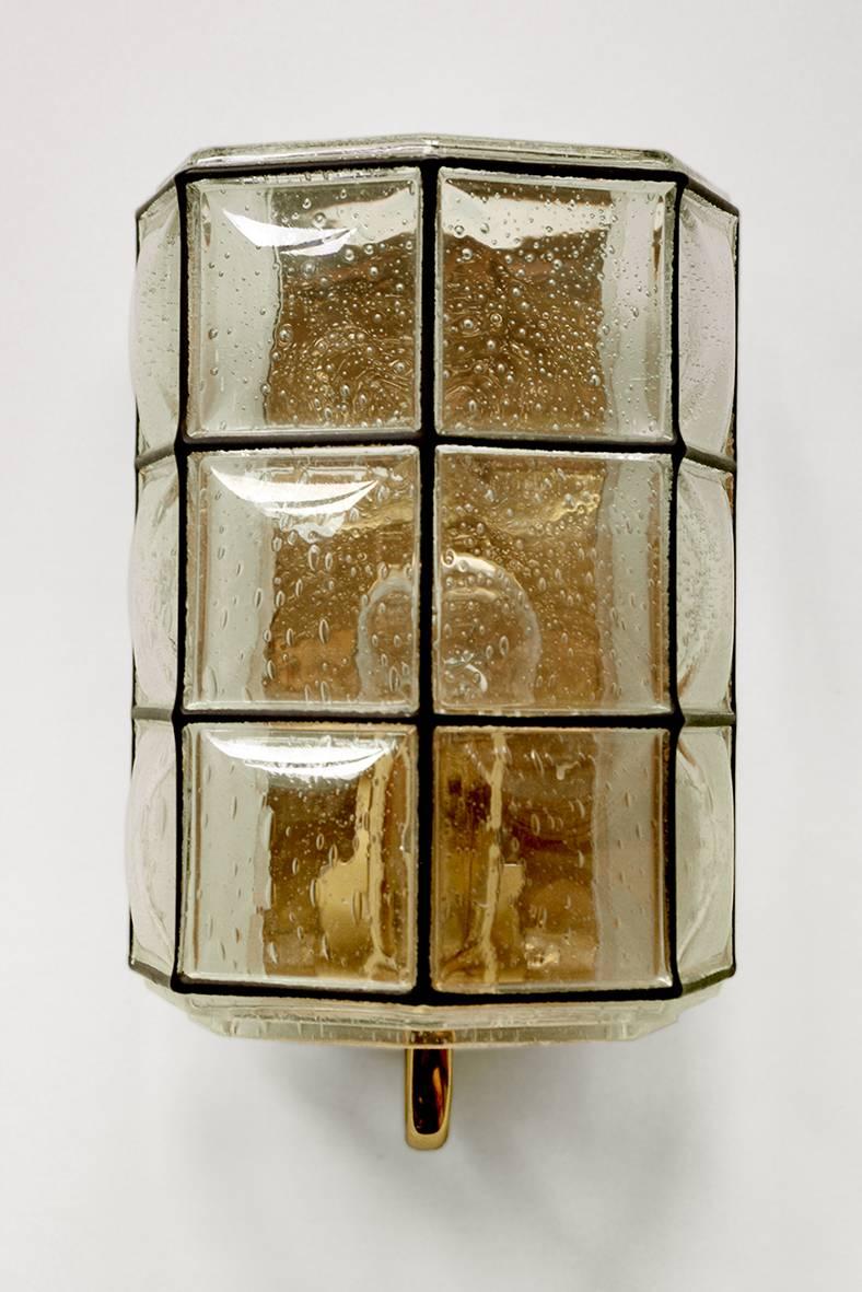 ONE of ... blown bubble glass and brass sconce by Limburg. 
Germany, 1960s.

