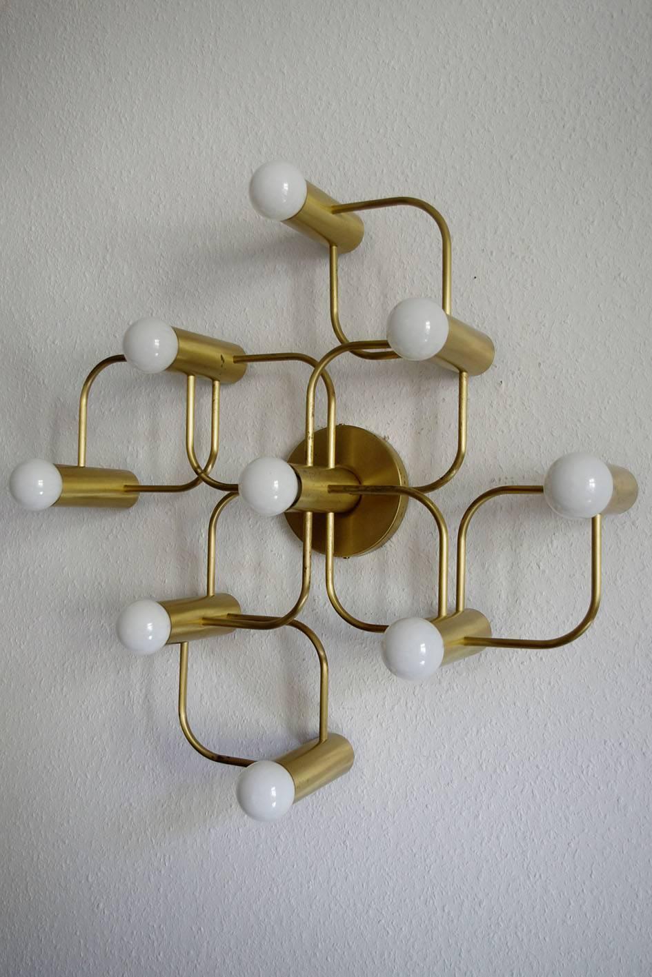 Sculptural Sciolari style ceiling or wall flush mount by Leola.
Brushed brass (gold) version.
Germany, 1960s.
  