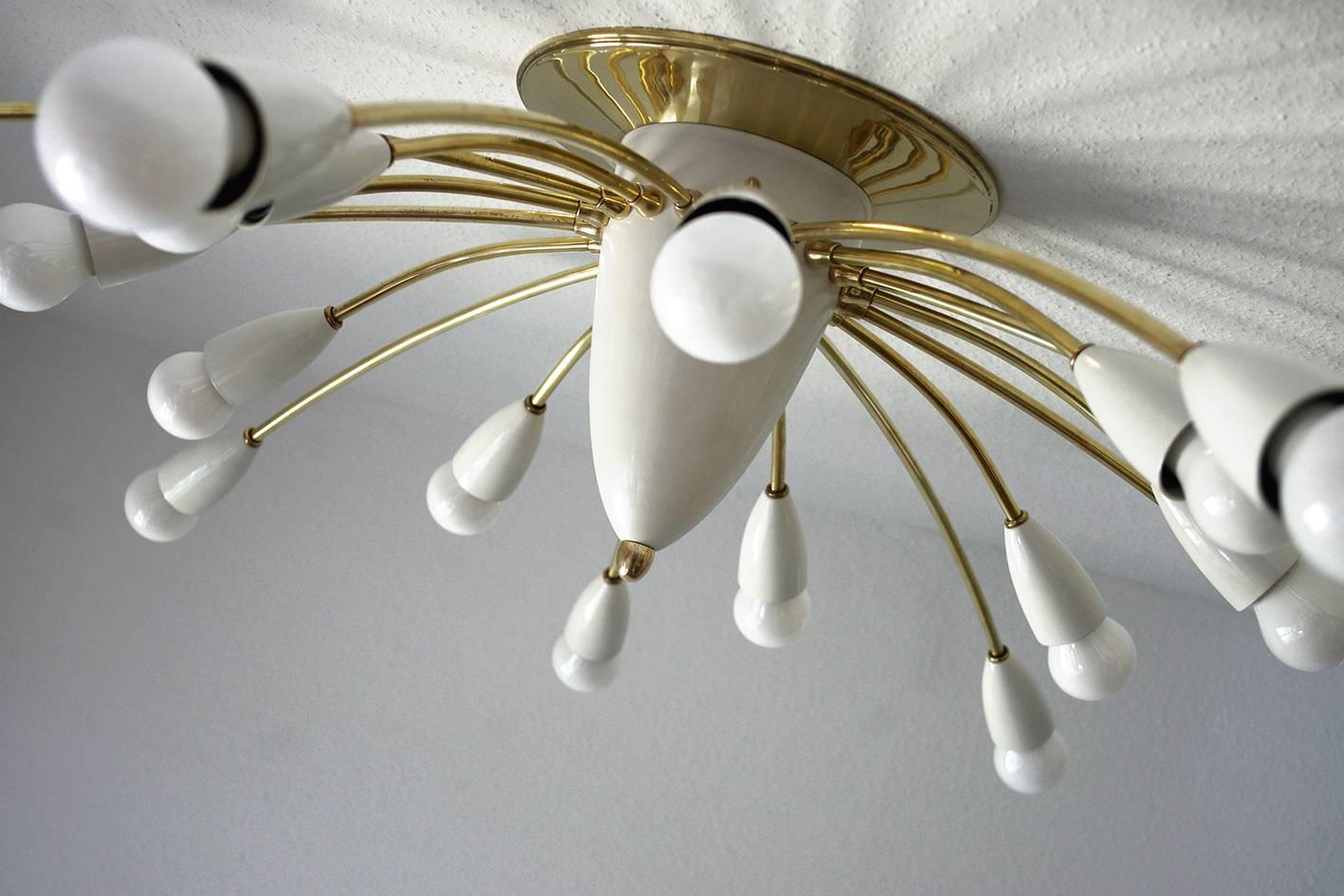 One of two huge Stilnovo style flush mount chandelier. 
Italy, 1950s
New rewired, lamp sockets: 18 x E27 (US E26).