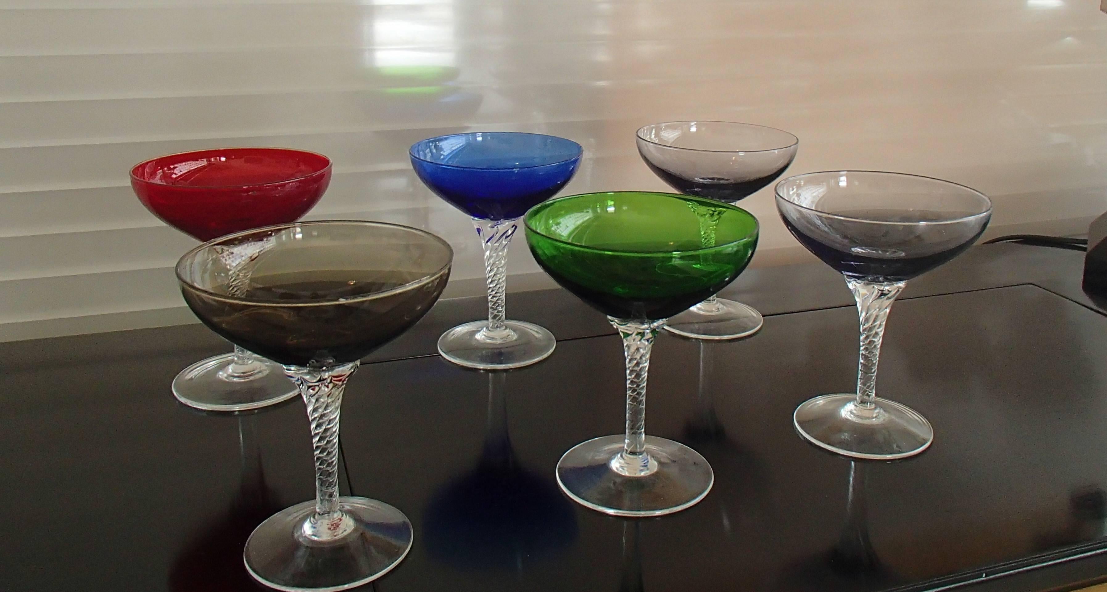 Six colorful Murano champagne cups on twisted base.
Red/green/blue/clear brown/clear grey/clear lilac.