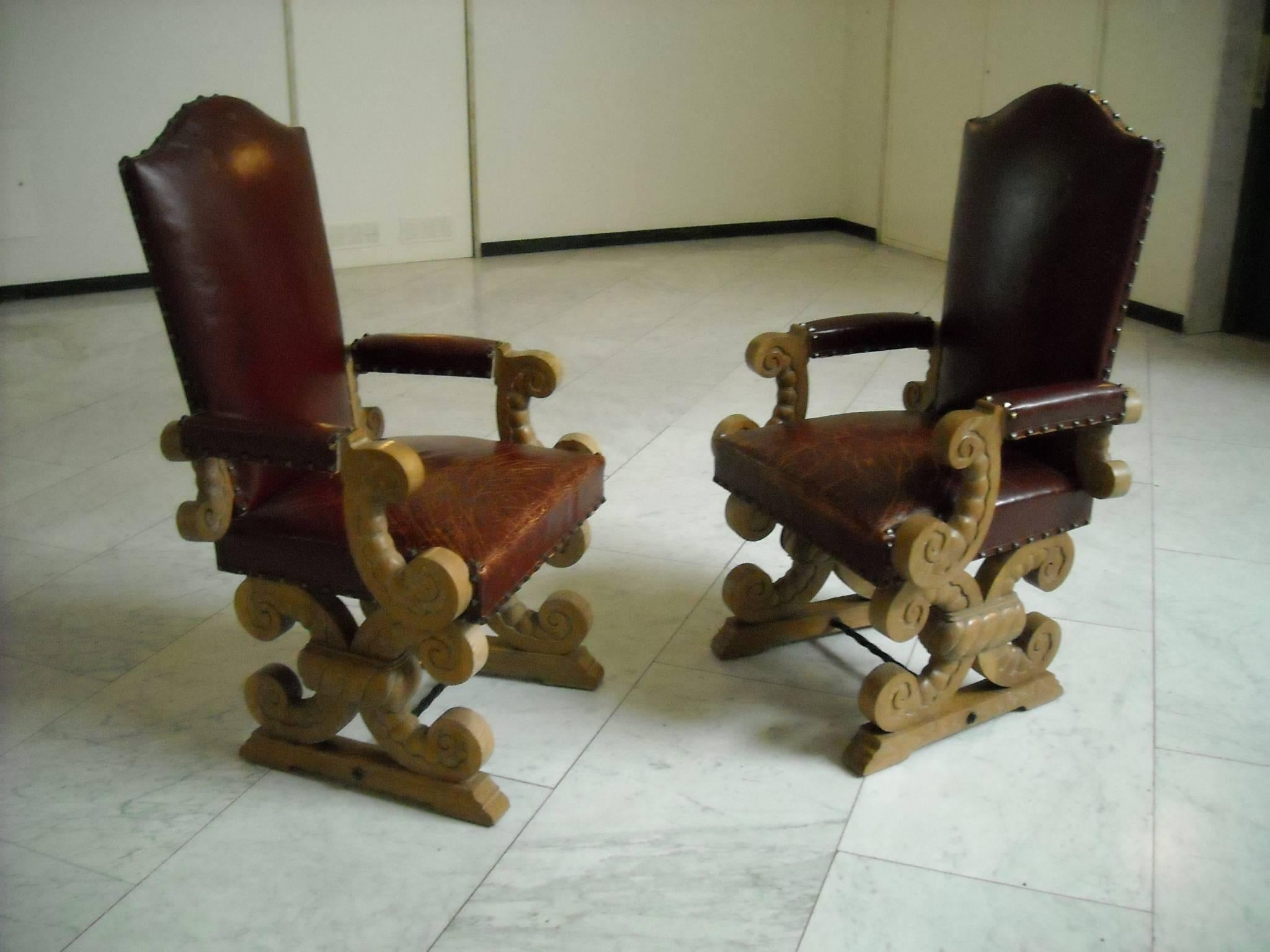 Rare pair of side or top of the table chairs. Chalked oak and original leather which all-over cracked but not ripped.