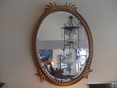 19th Century Hughes Mirror with Oval Golden Frame