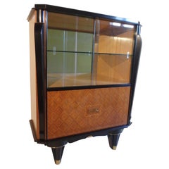 vitrine with very sophisticated inlay on the doors and brass look