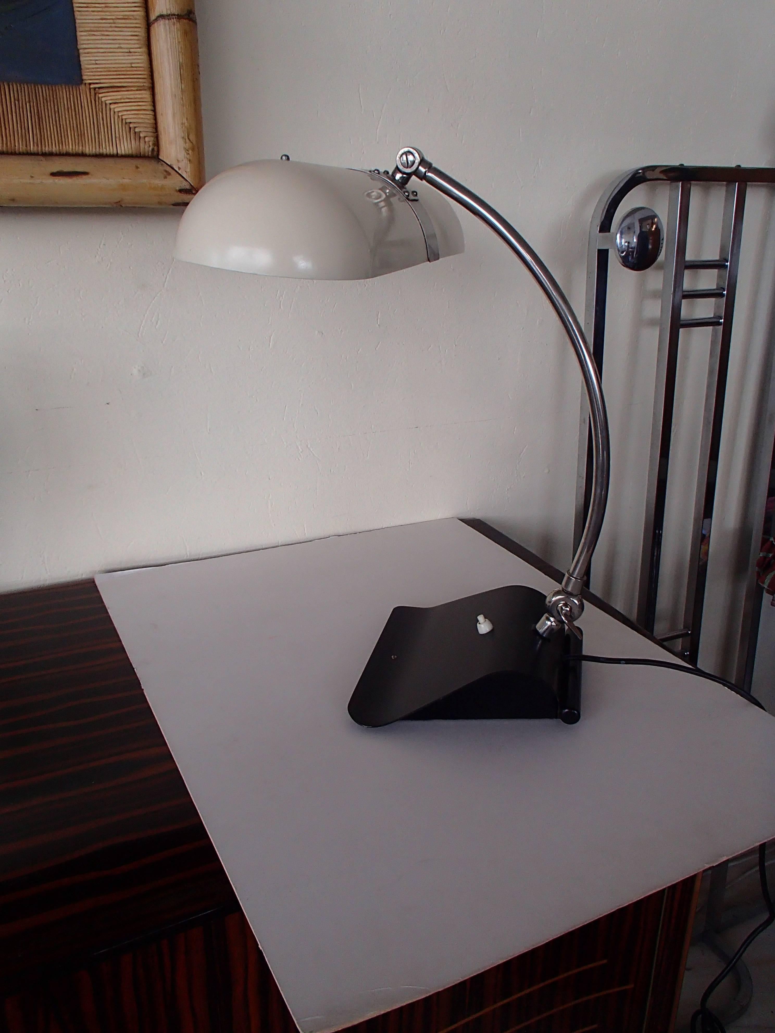 Very with big desk lamp with neon light black foot and off-white shade two parts to move the lamp.