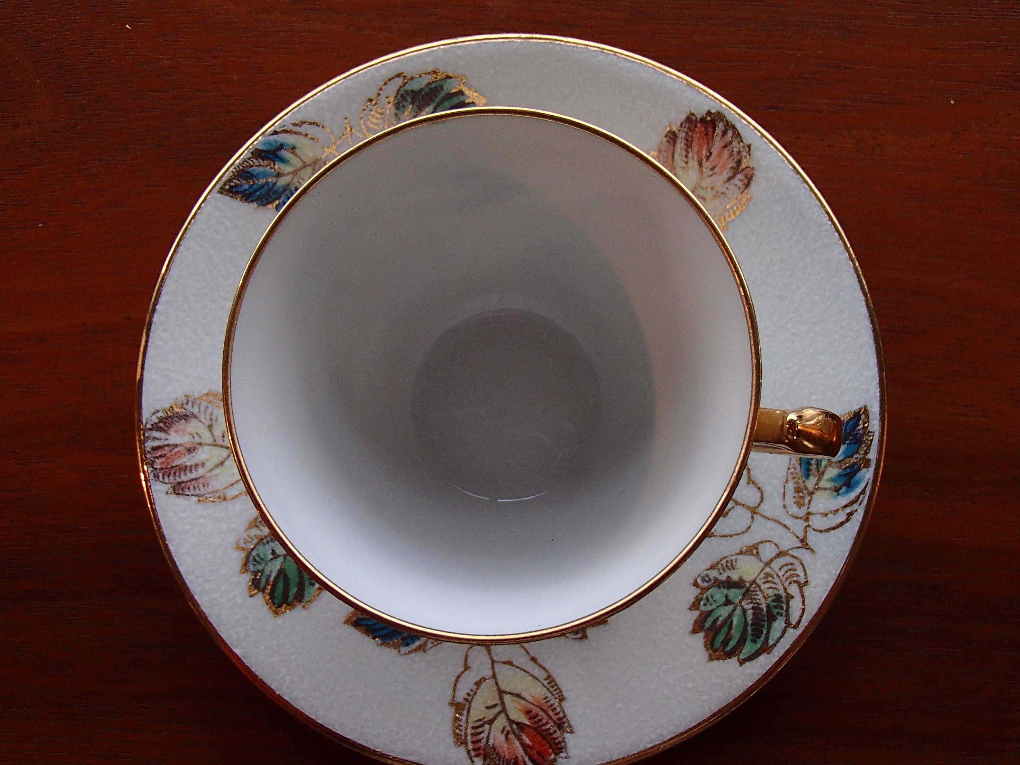 20th century Limoges hand-painted relief decor porcelain coffee cup by R.Leclair.