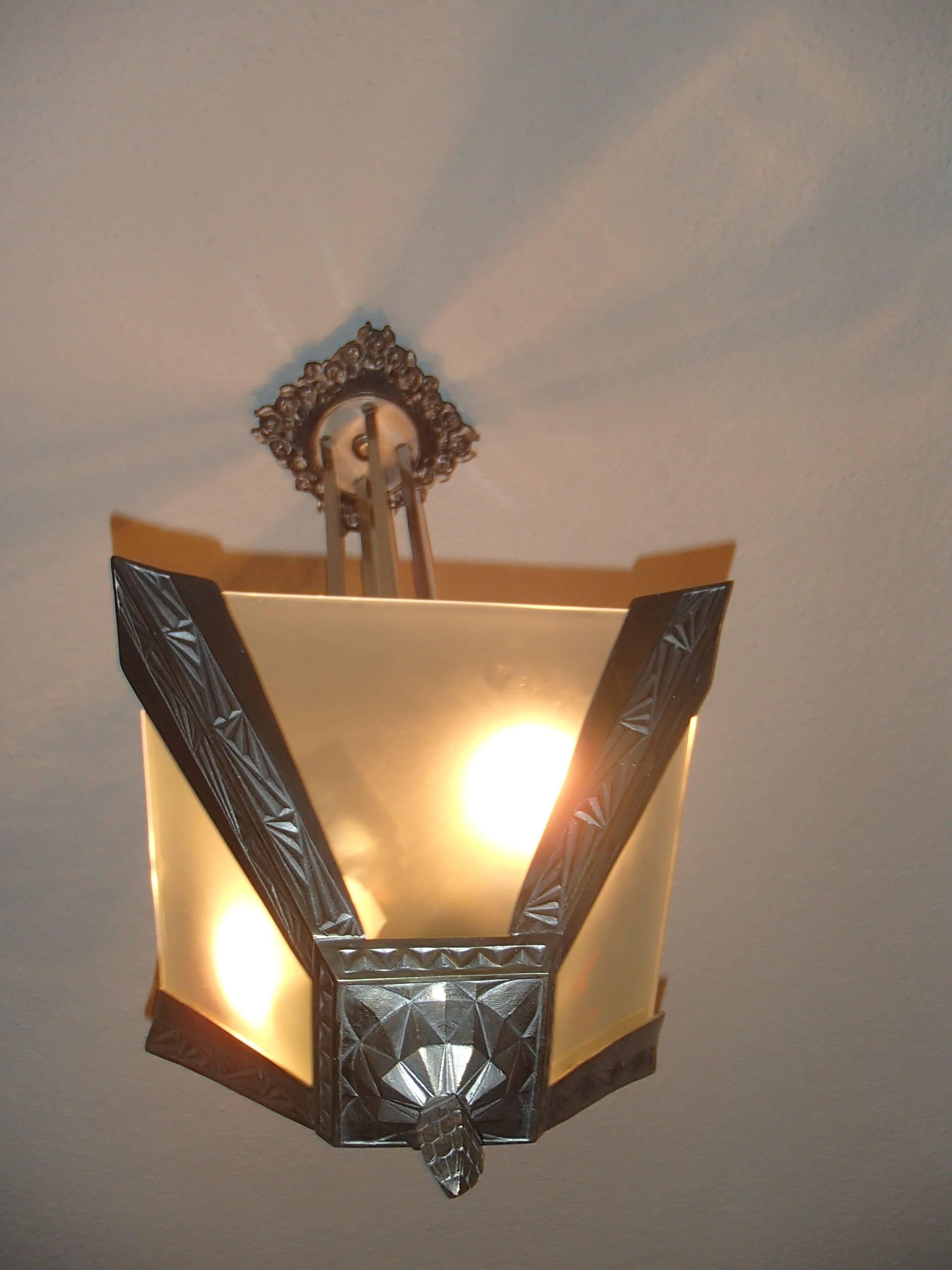 Molded Art Deco geometric  bronze nickeled chandelier with satined glass For Sale