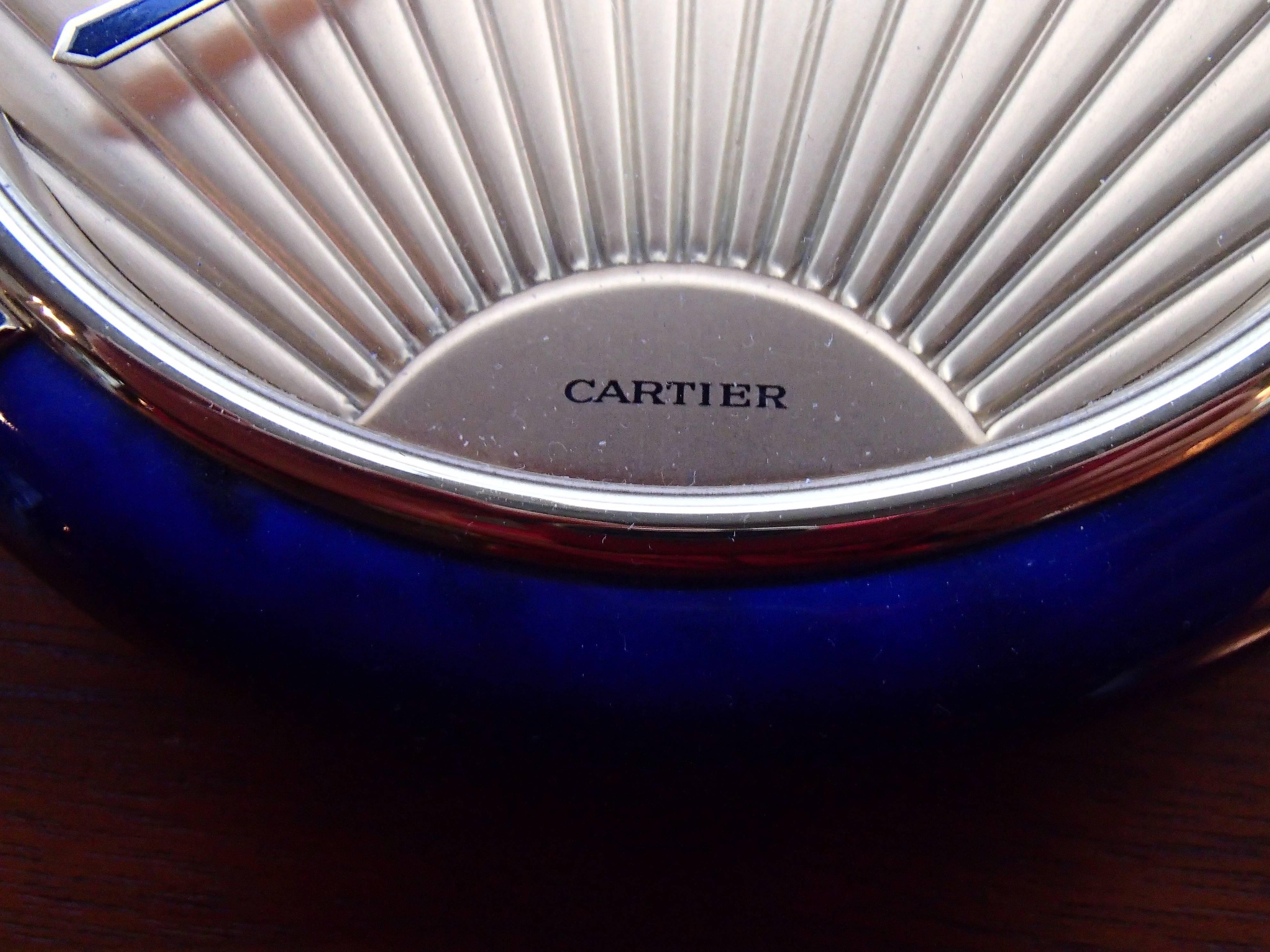 1980 this Cartier blue enamel Art Deco table clock. In full working condition with batteries. Some damage on the back side.