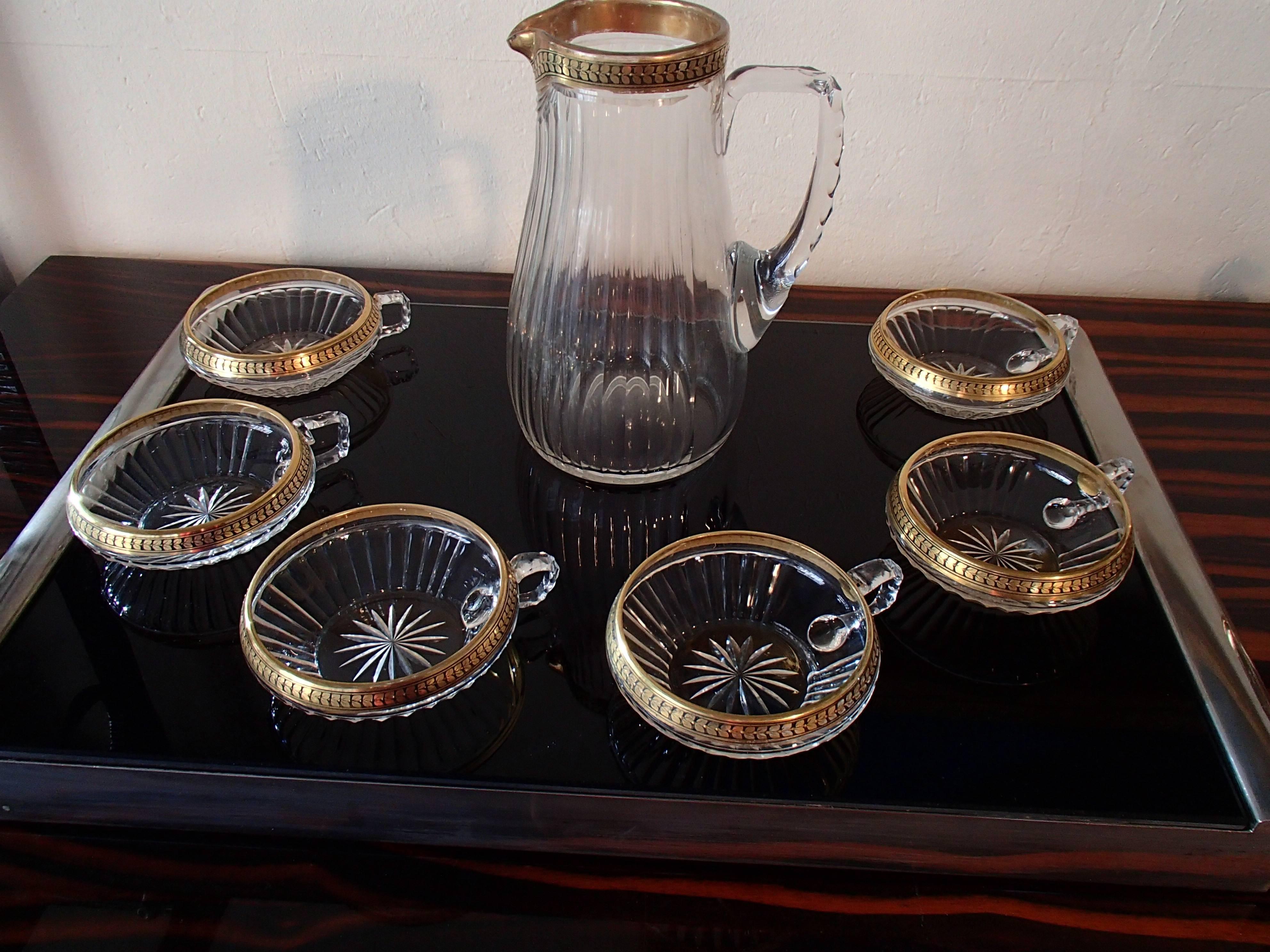 1920 Bohemian crystal set of six cups and jug gold leaf paint.
The jug is 20 cm high the cups 4 cm and the diameter is 10 cm for both.
