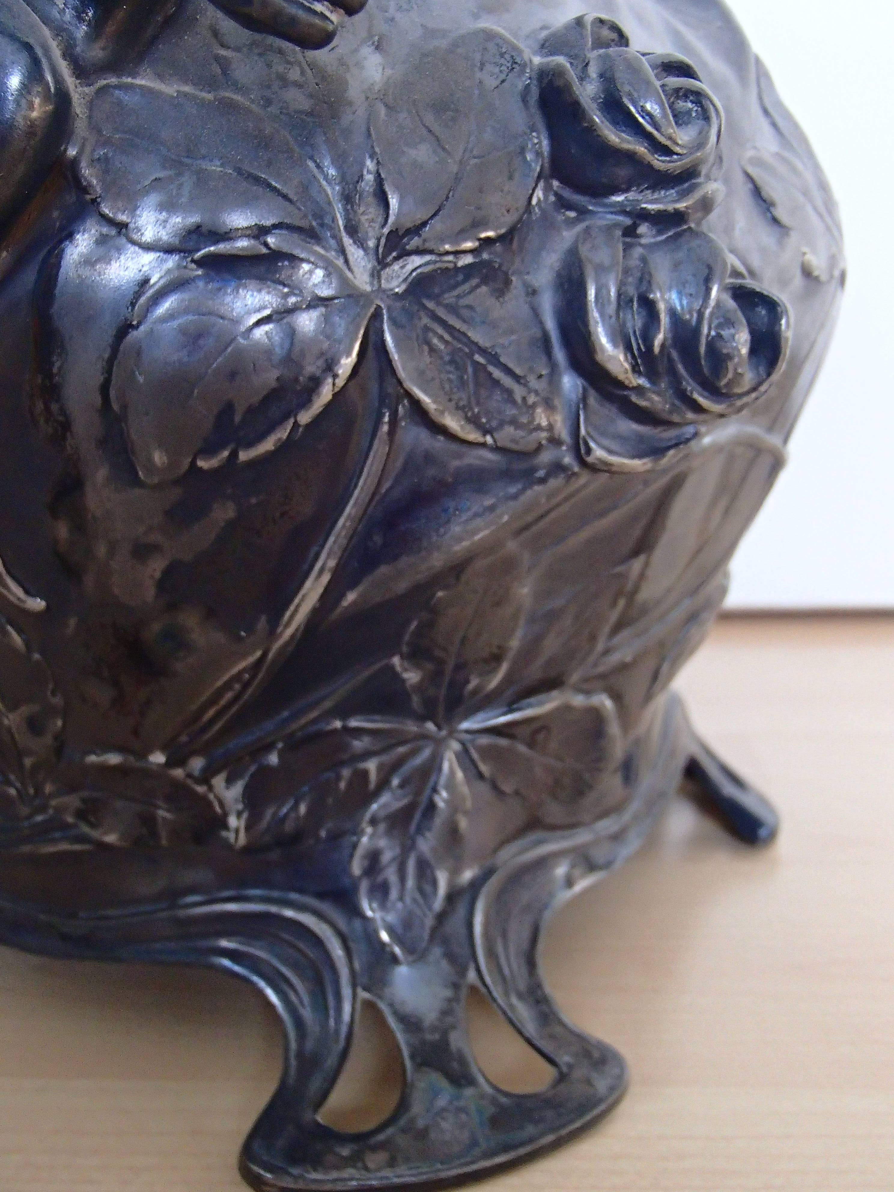 Huge WMF tin silver plated Art Nouveau vase with female figure and putto.