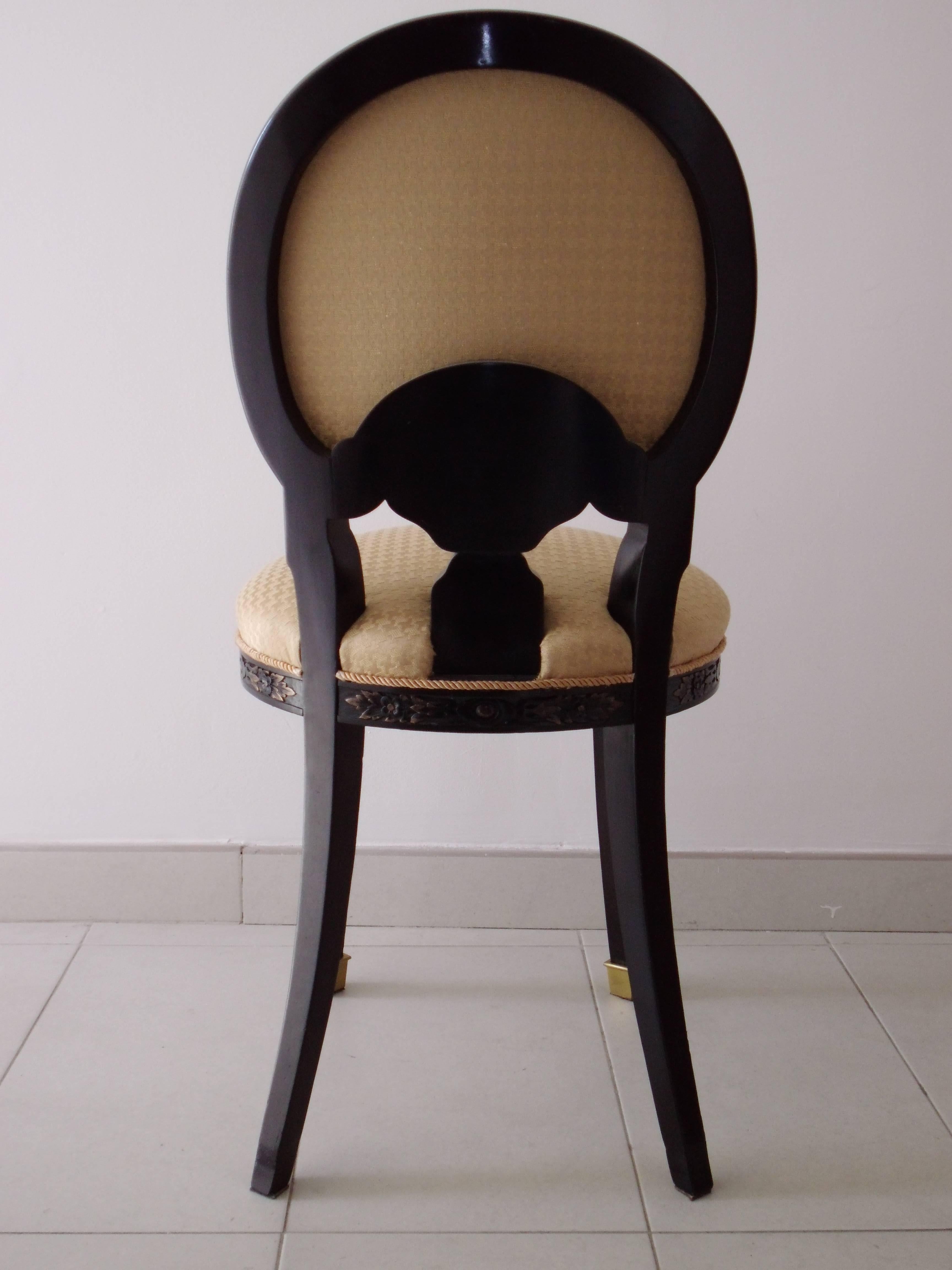 19th century single chair in black and yellow.