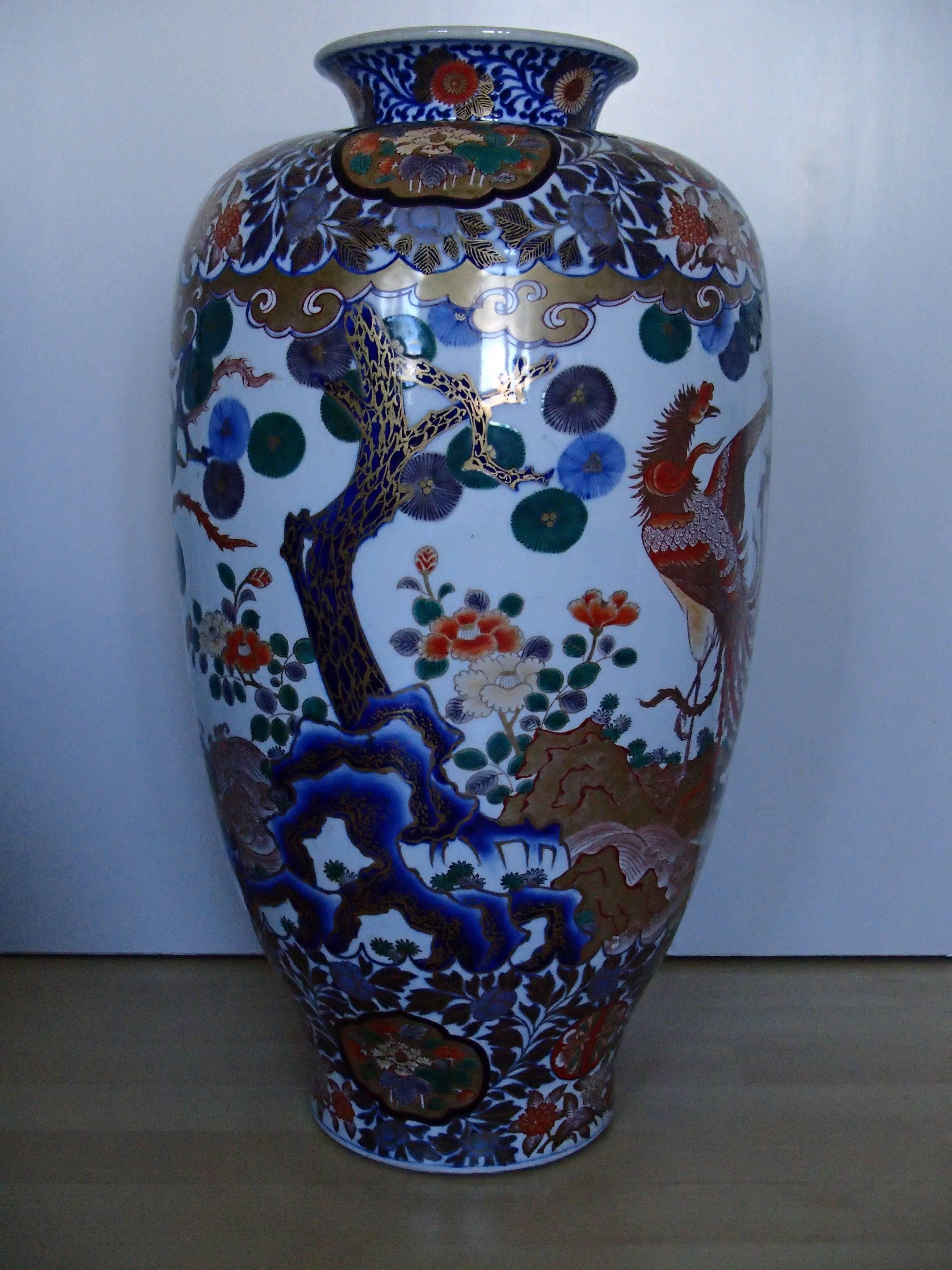 Huge Imari vase with email painted with birds and kiku flowers.
