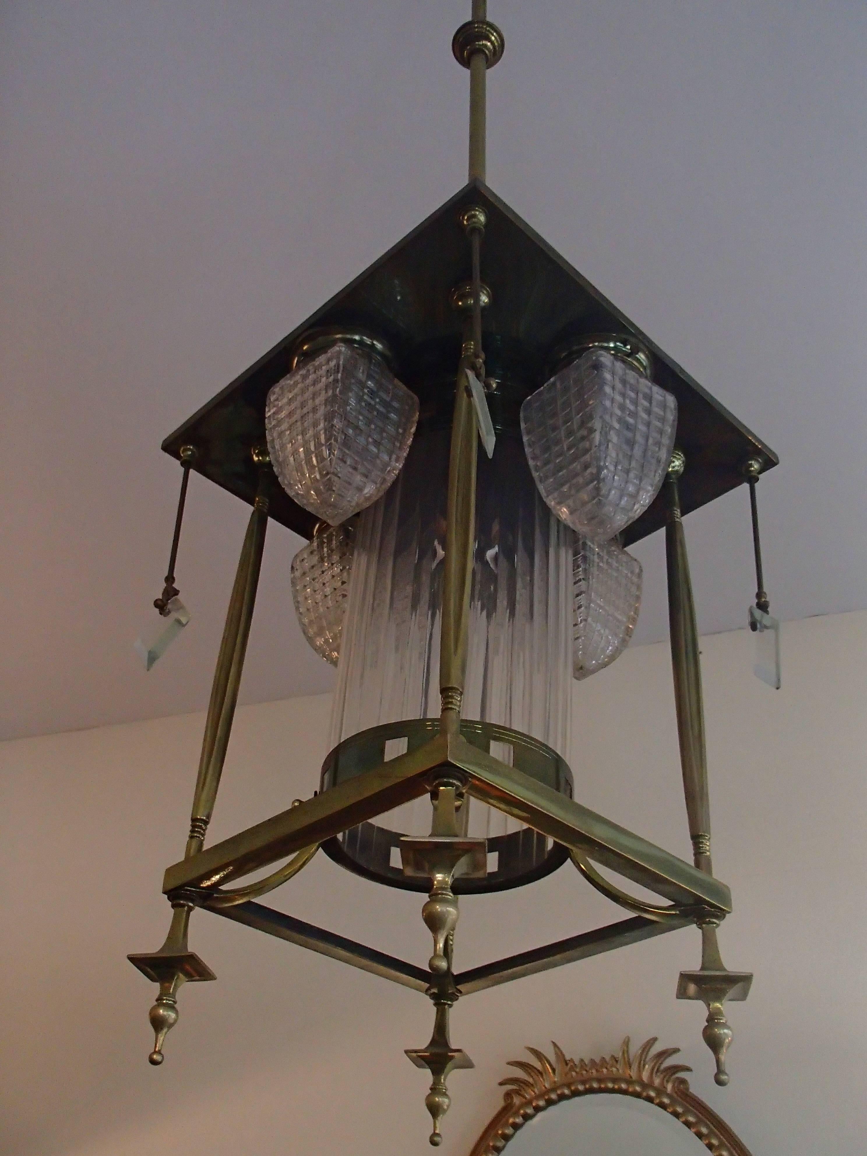 19th century Art Nouveau very long chandelier square bronze and glass.