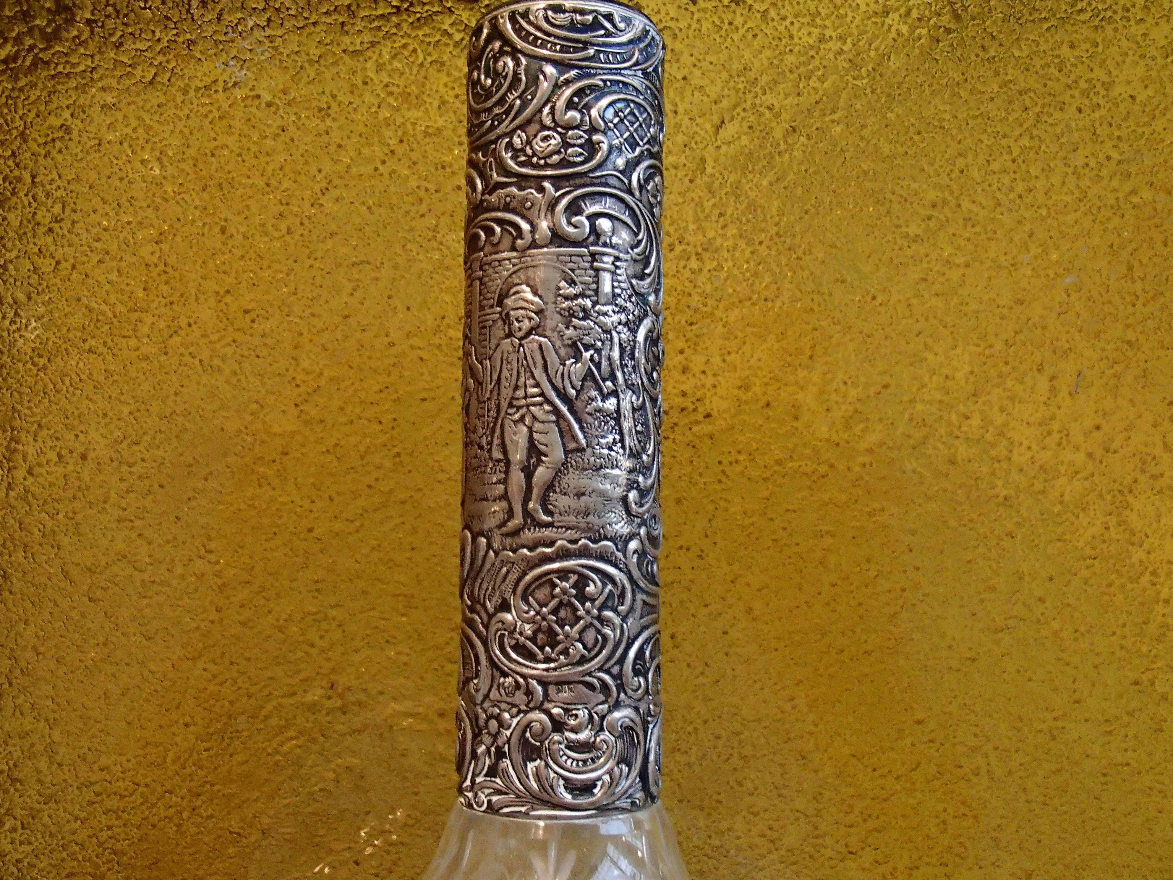 19th century Bohemian carafe carved glass, silver neck and tape.