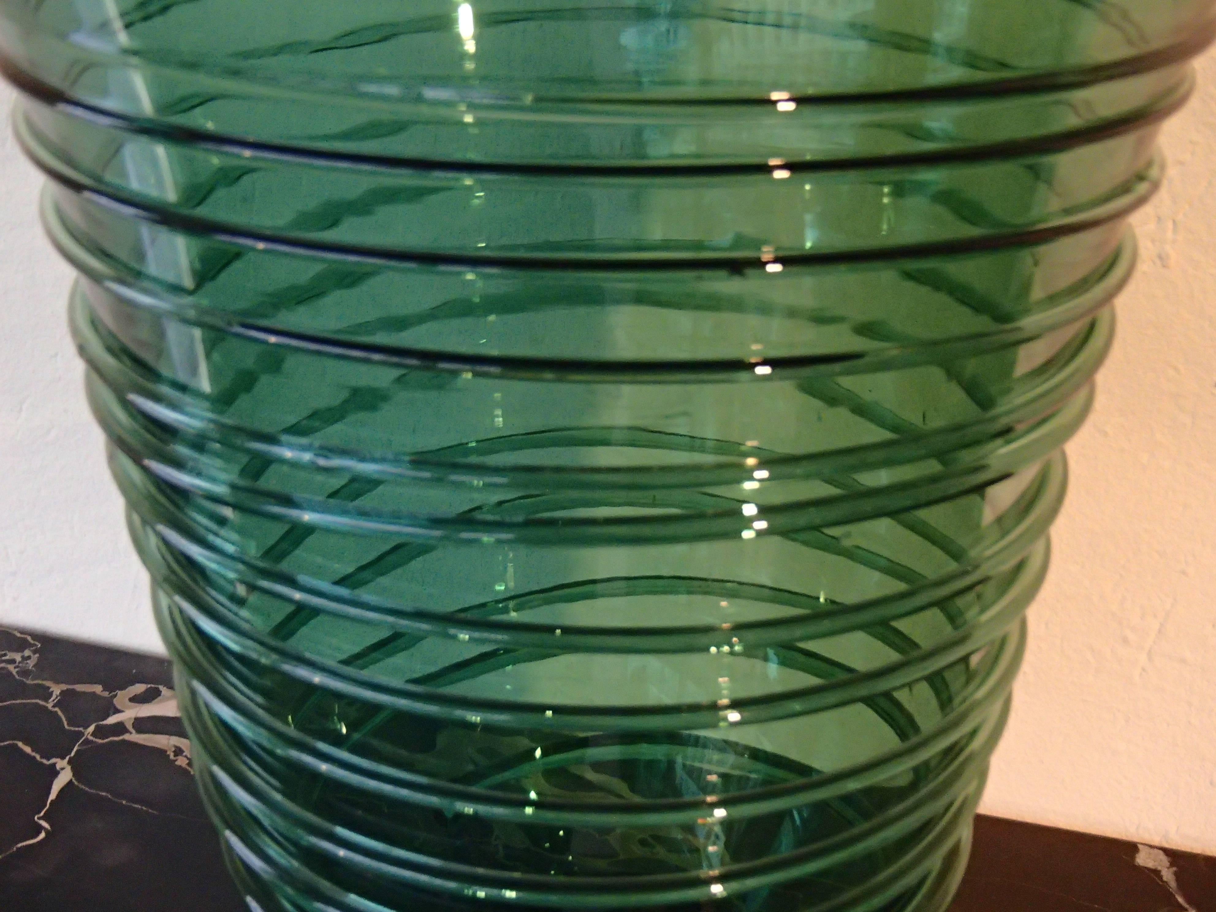 Midcentury huge green glass vase with spiral decor.