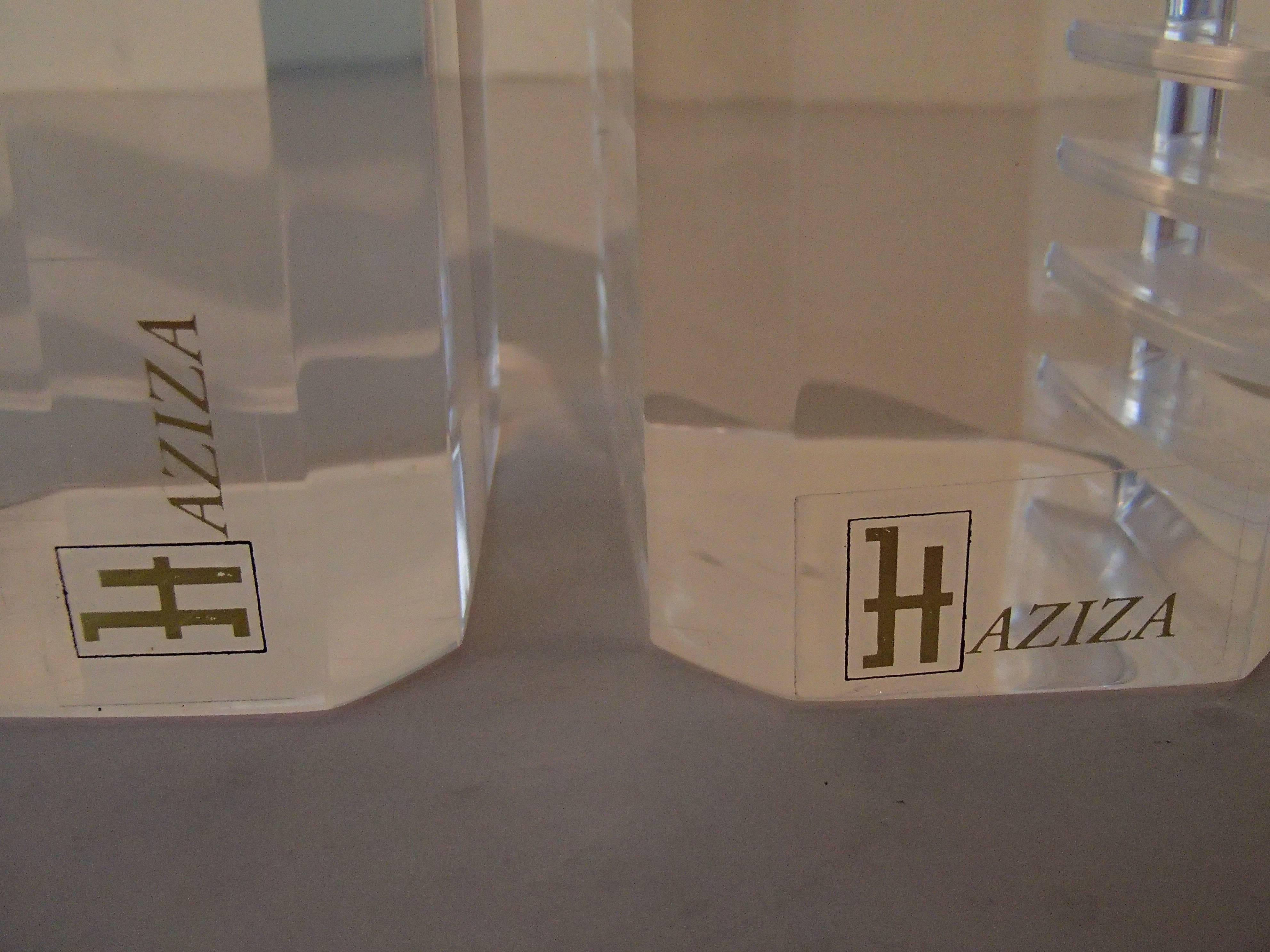 Pair of modern Haziza plexi glass sculptures transparent and pink ball.
