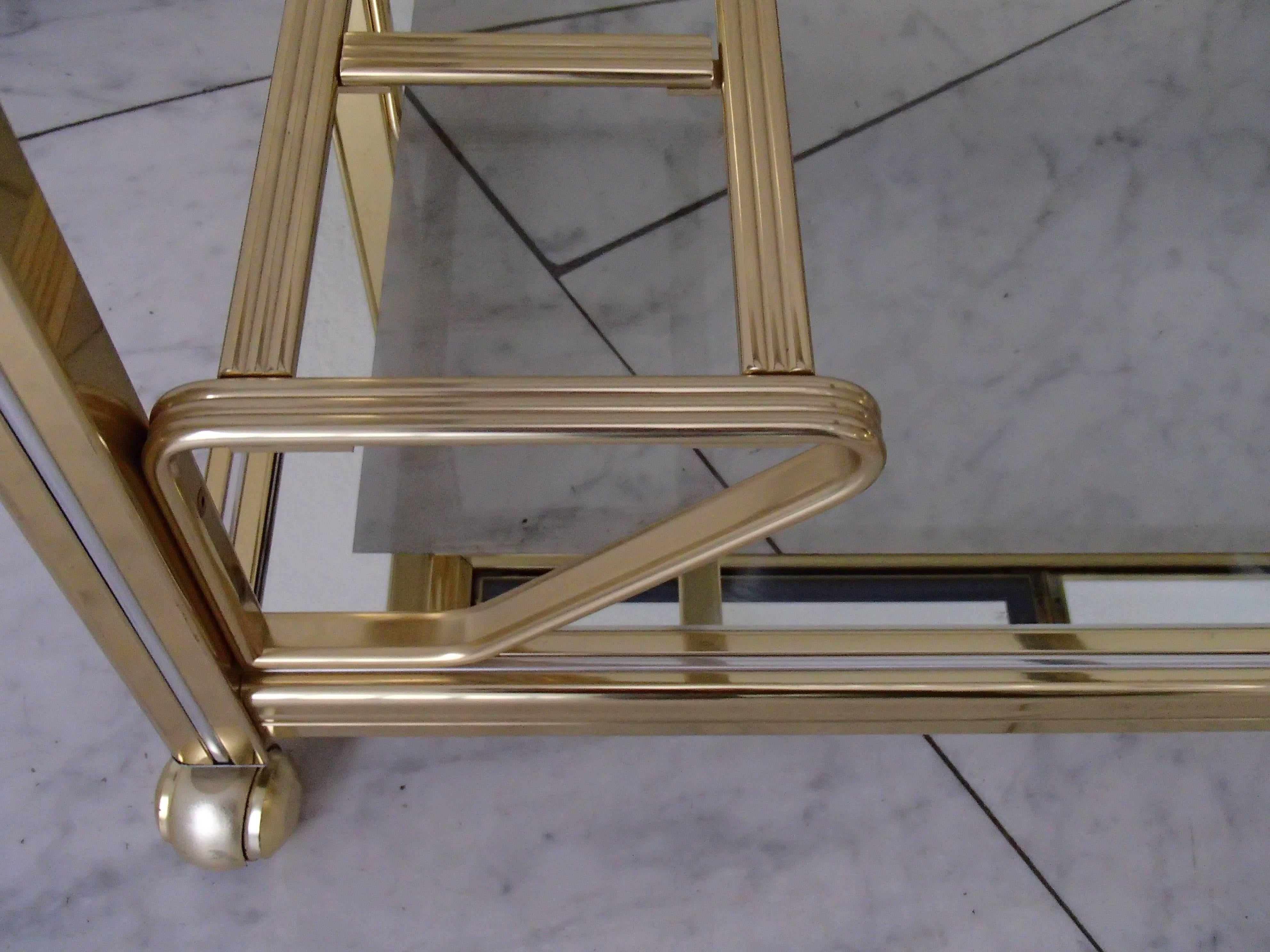 Modern brass and glass drinking trolley removable tray.