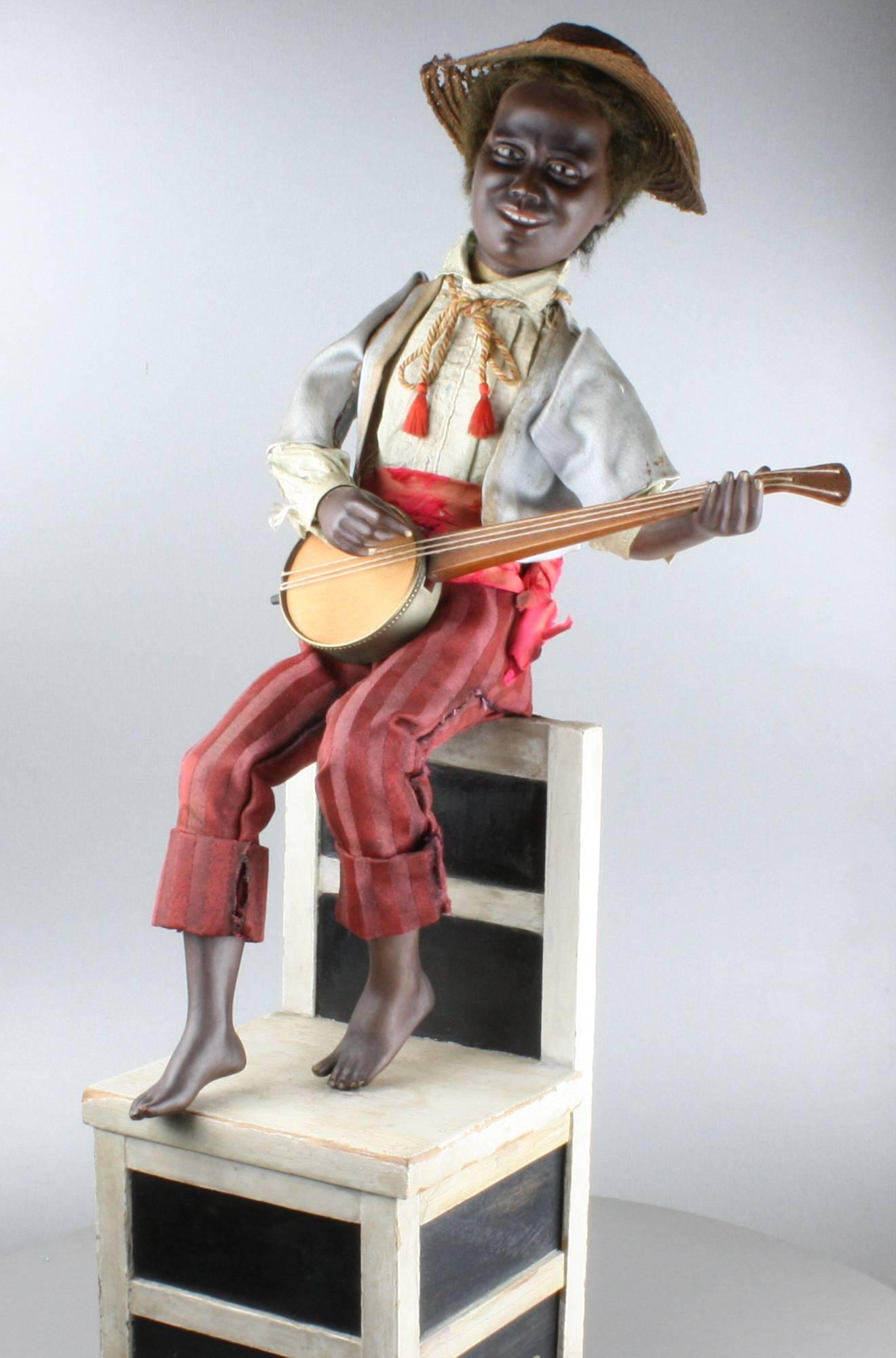 A mesmerising antique black banjo player musical automaton by Gustave Vichy,
 
French,
 
circa 1900.
 
Shown at the Automates Musiciens Exhibition at Palais Lascaris, Nice Carnaval, 1978, object number VII, by Jacques Damiot.
