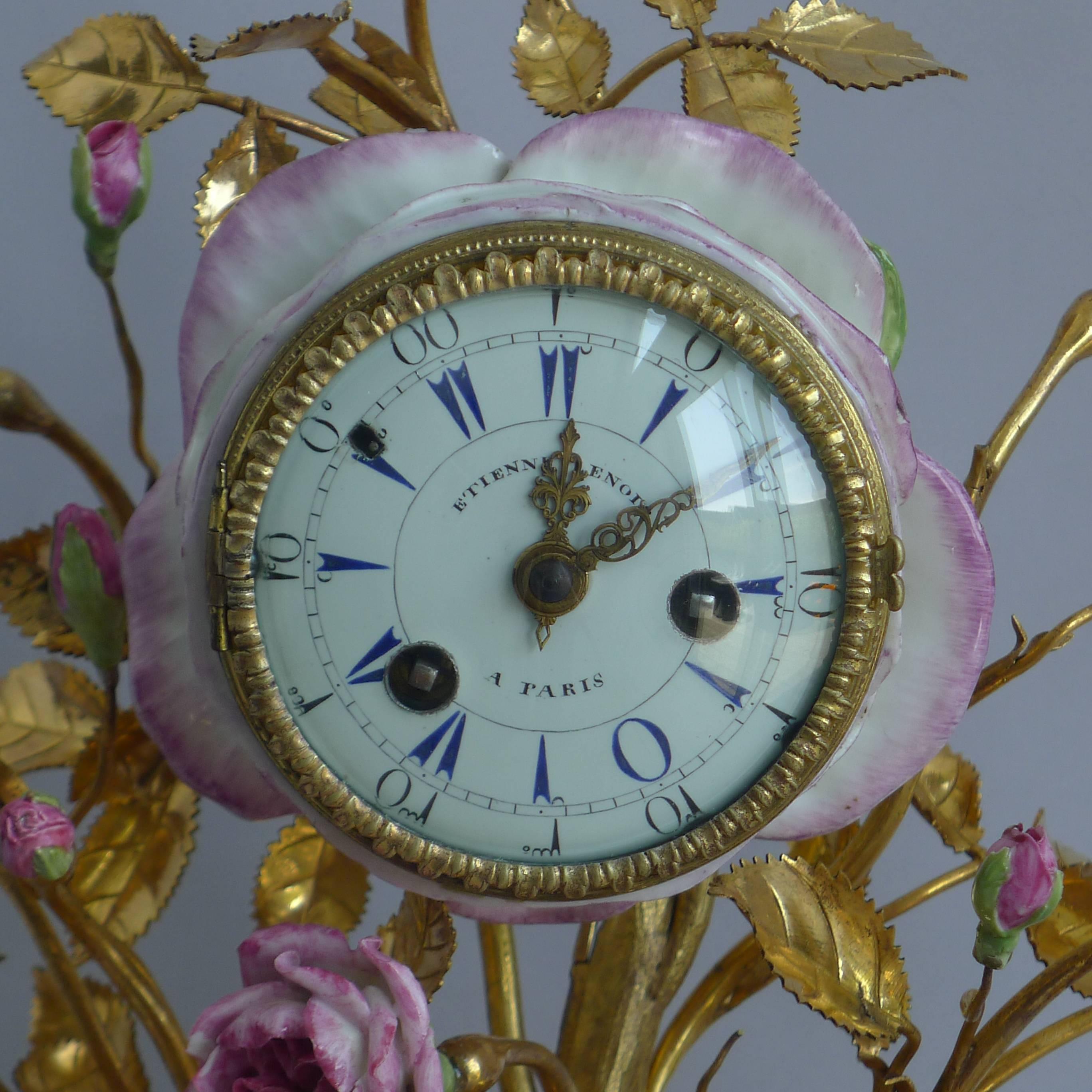 Fine French Louis XV ormolu and porcelain mantel clock. The fire gilded ormolu on this clock is entirely original and in almost mint condition. The clock sits on an extremely Fine, scrolling Rococo base. The ormolu stems and leaves look stunning,