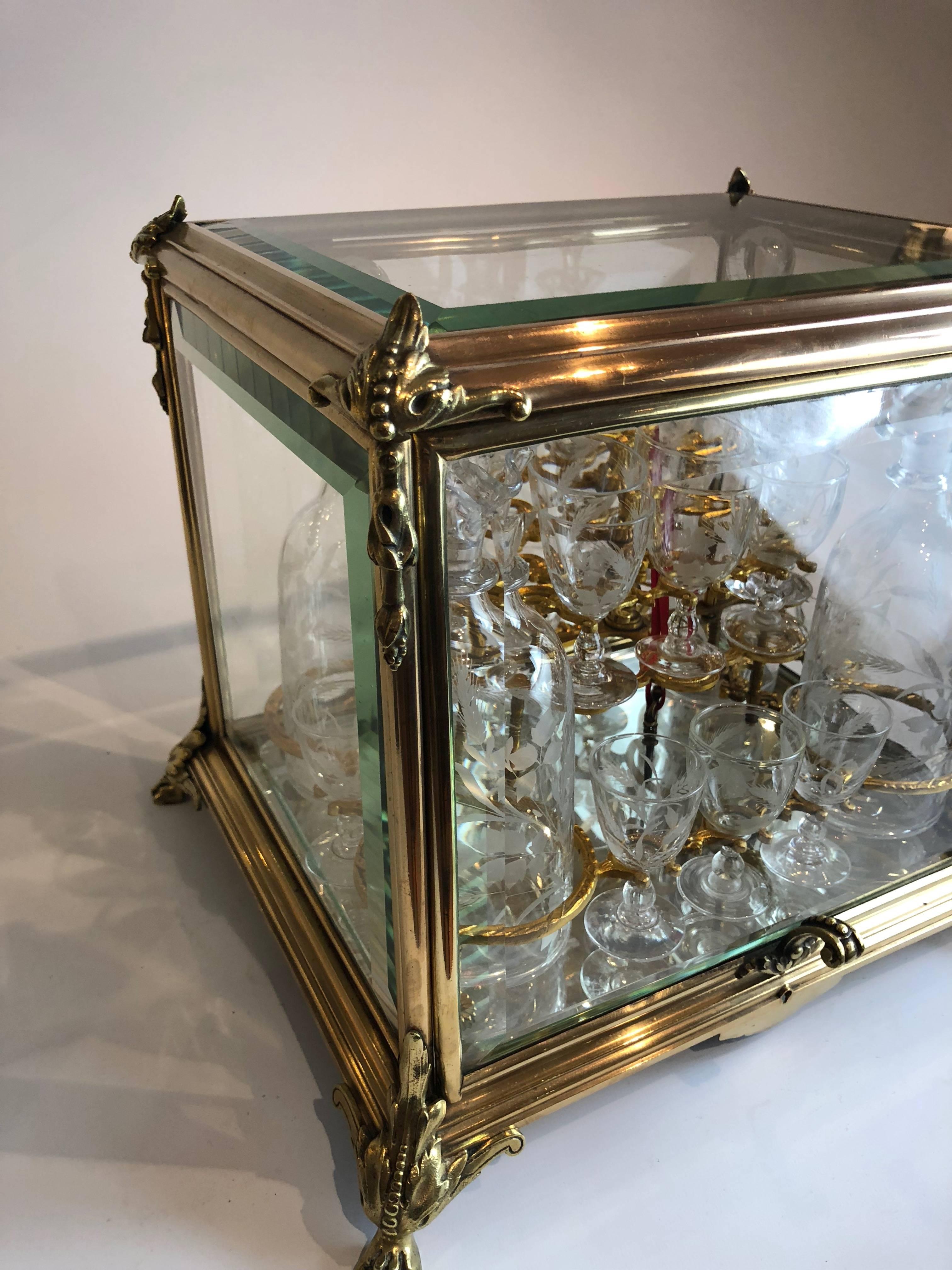 A stunning French 'Cave à liqueur' comprising a casket, four decanters and 16 glasses, all of which are original matching engraved examples. 

With original lock and key.

French, circa 1880.