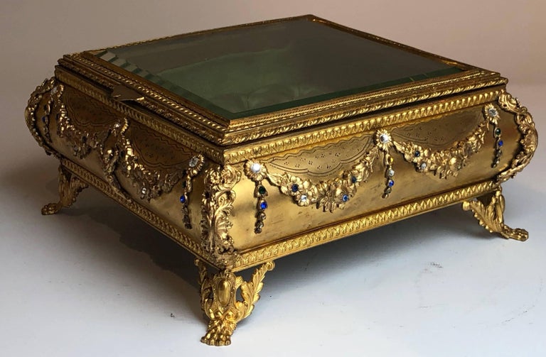 A large French gilt bronze and semi-precious stone jewel box/casket

French, circa 1880.