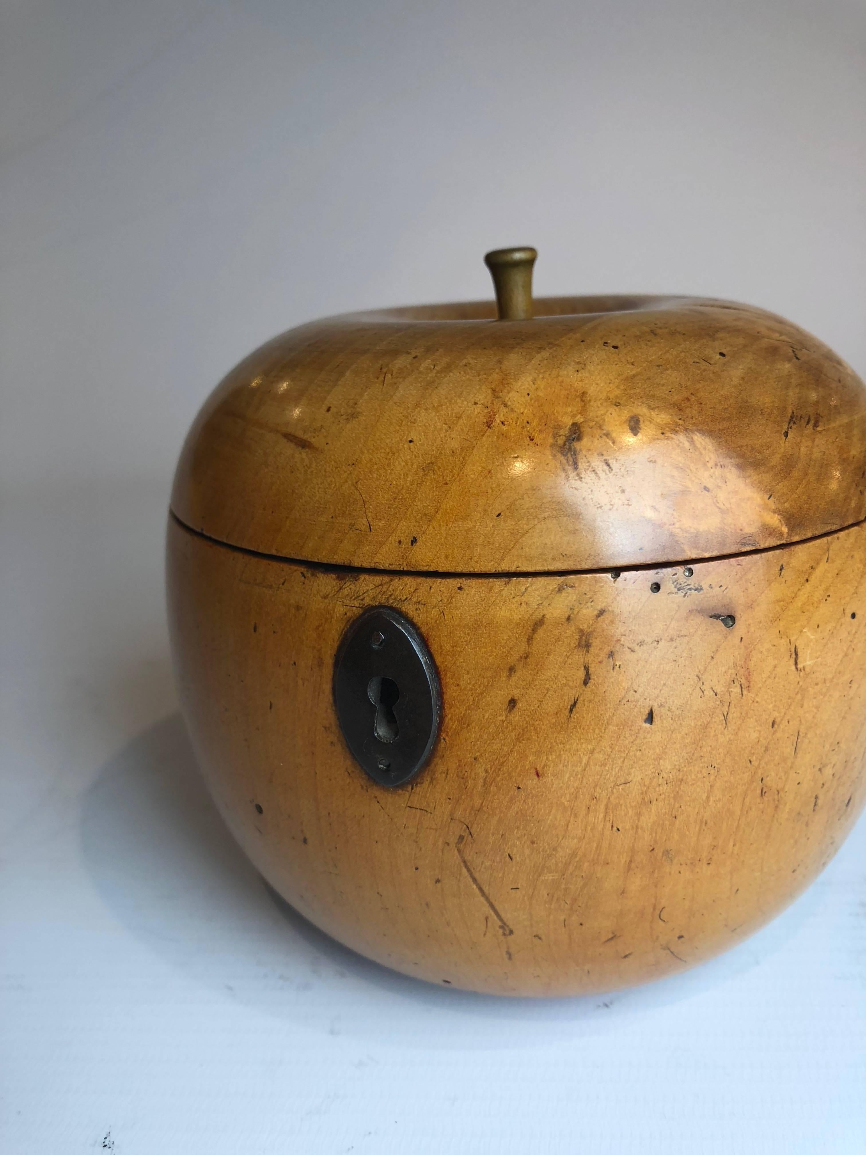 An excellent example of a late 18th century apple shaped fruitwood tea caddy.
Great colour and patination

This treen apple tea caddy still has traces of its original tin foil lining