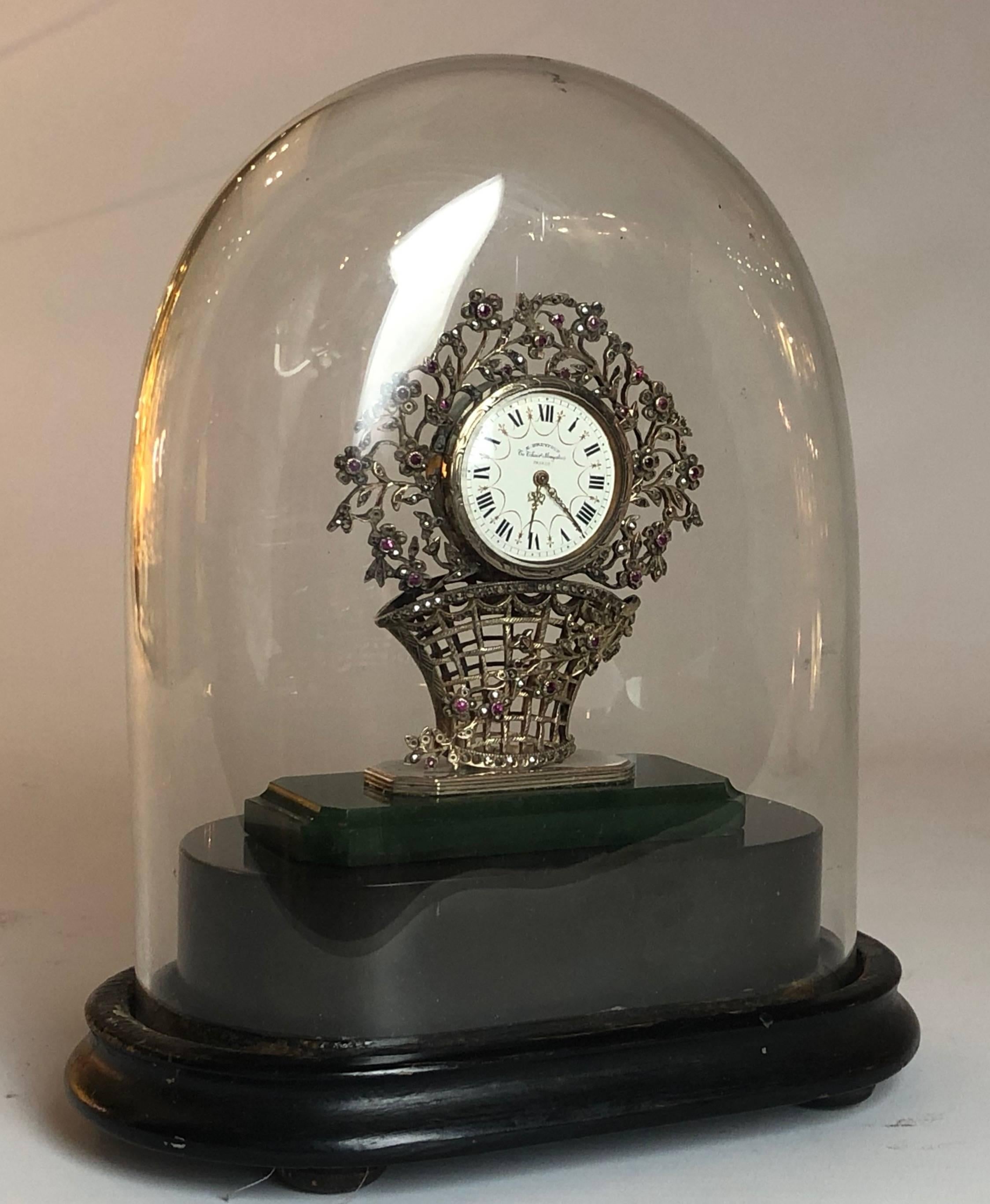 This beautiful antique miniature table clock is small but perfectly formed, featuring a delicate inlay of precious stones.

From the highly respected clockmaker Edouard Henry Dreyfous

Paris, circa 1880.

Measures: The clock out of the dome