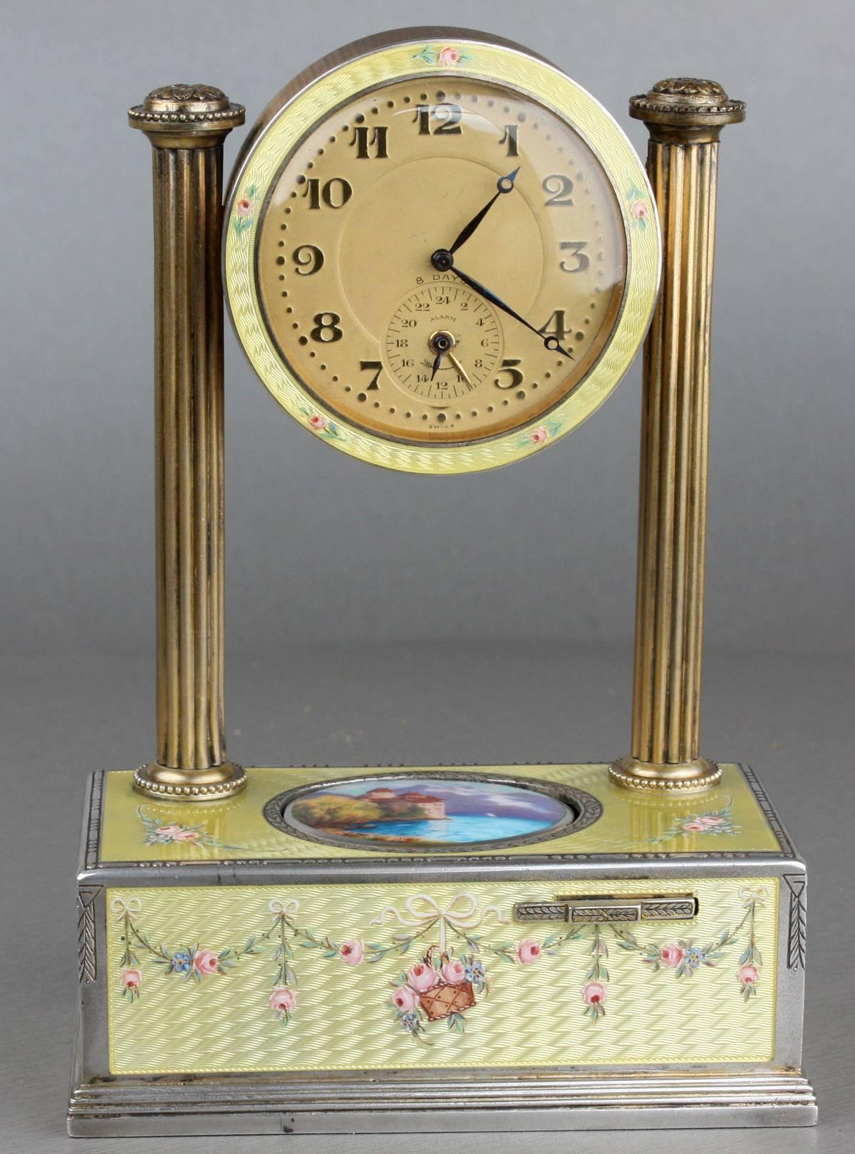 An extremely fine vintage richly-hued silver gilt, guilloche yellow enamel and pictorial enamel timepiece alarm-actuated singing bird box, by C. H. Marguerat
 
Swiss,
 
circa 1925.
 
Serial number 346.
 
Awake from your dreams the Swiss