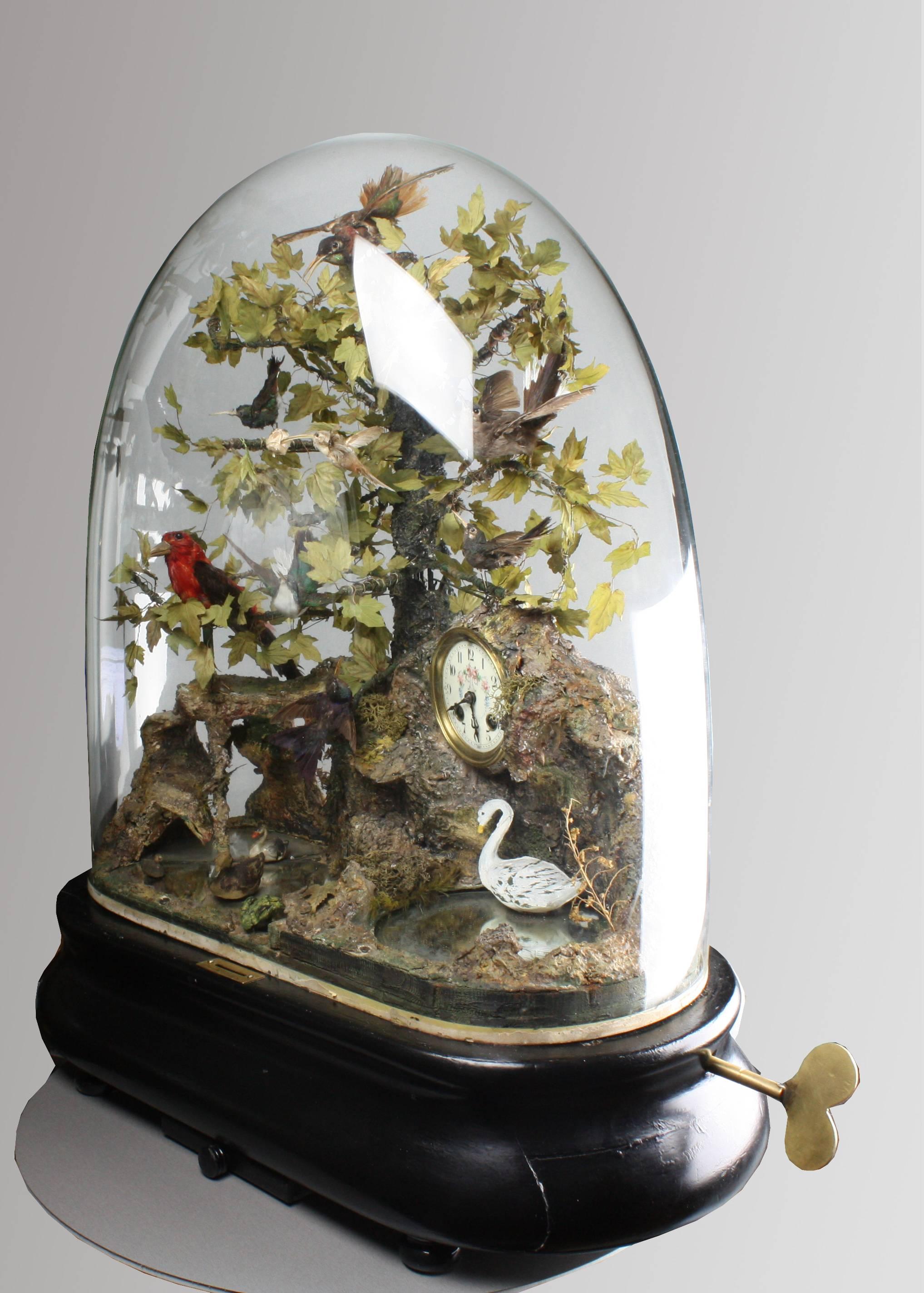 An incredible antique coin-operated double bird jumper, singing bird and multi-action automaton timepiece under glass dome by Bontems,
 
French,
 
circa 1900.
 
Japy. Frères timepiece movement No. 32329,
 
This masterpiece automaton by