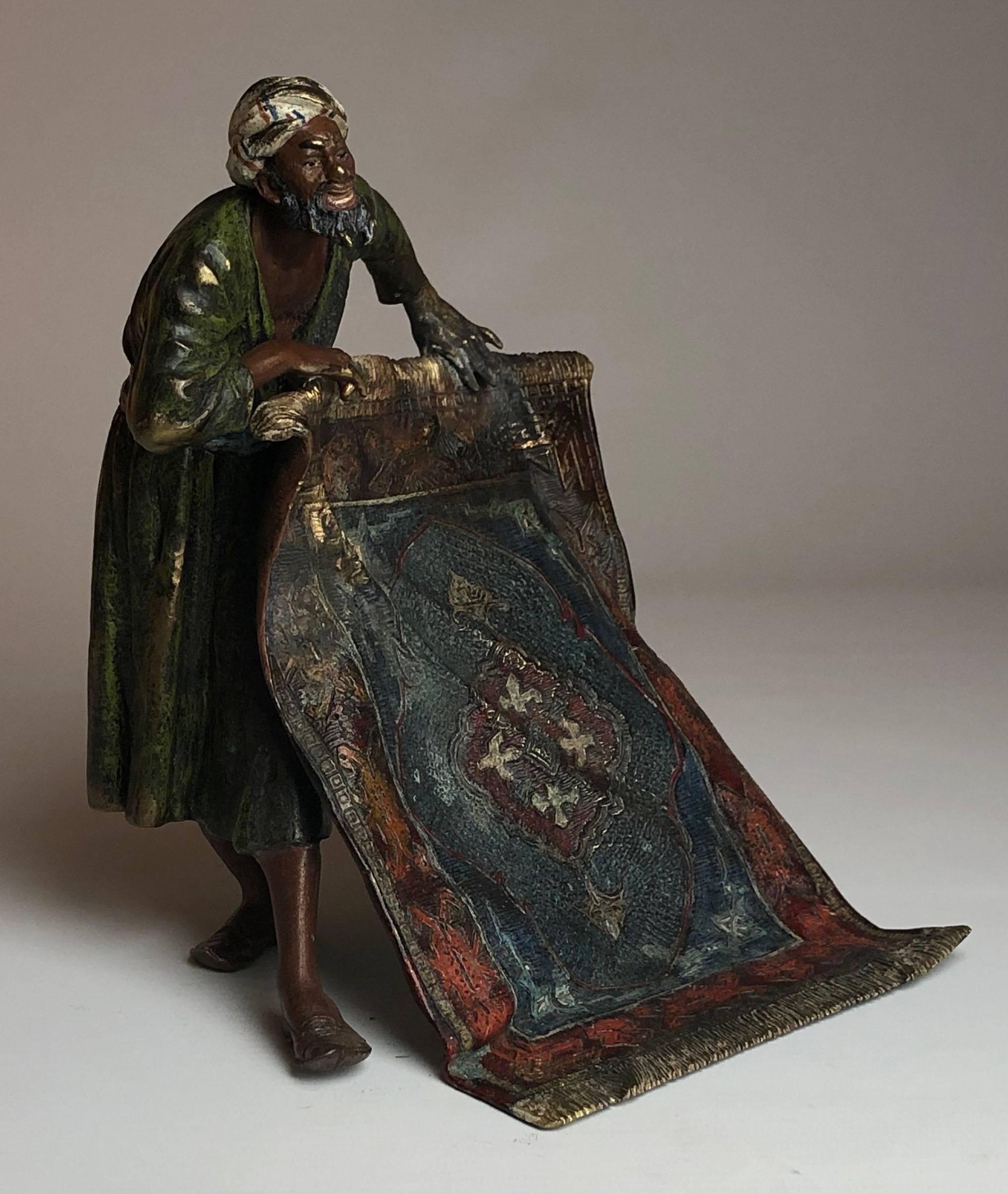 A very fine early 20th century cold painted Austrian bronze study of an Arab man selling carpets with excellent color and stunning hand finished detail.

Measure: He stands 8