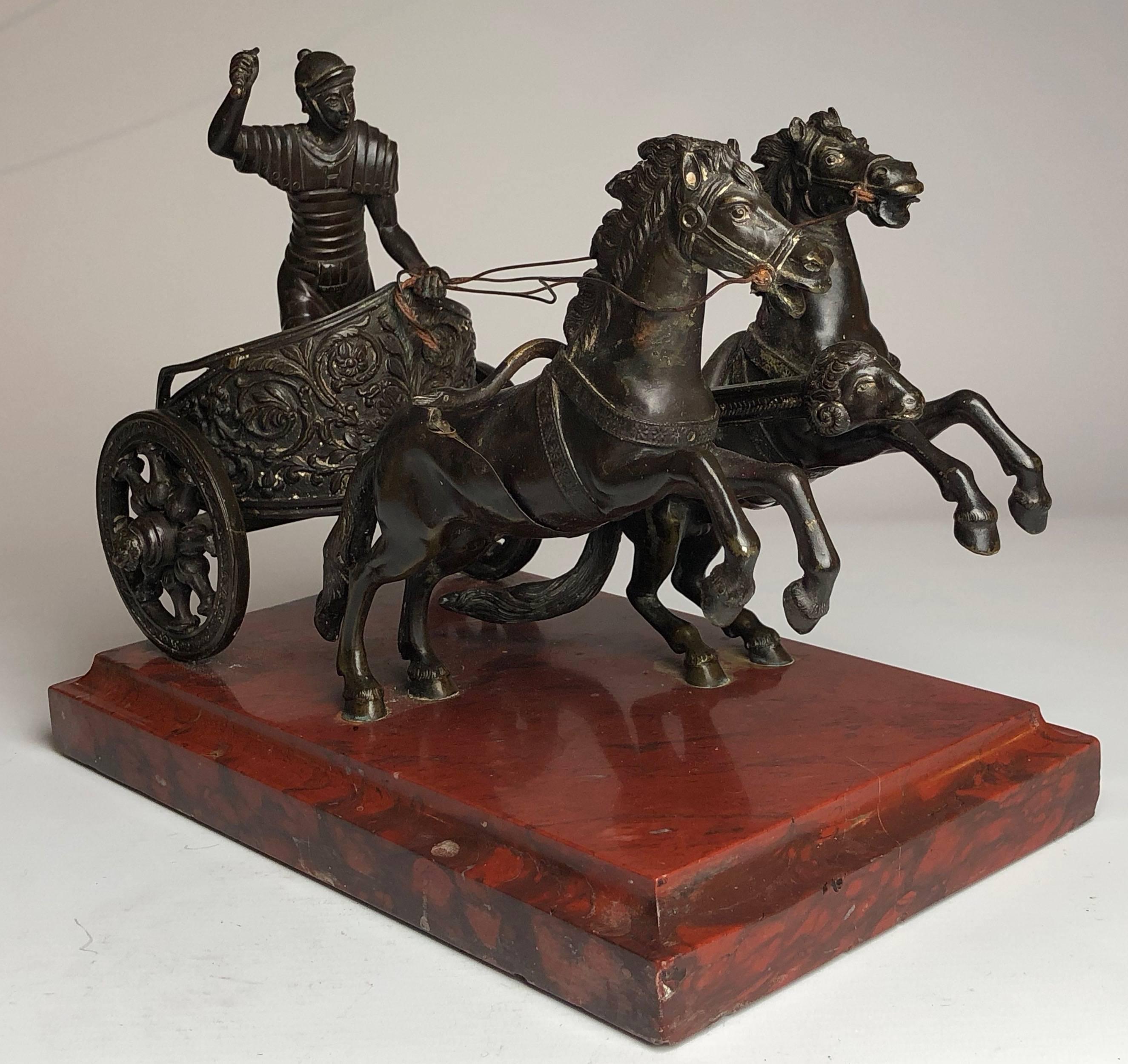 Superb quality bronze depicting a Roman Chariot pulled by two horses
On a reuge marble and bronze base.

The piece measures 10