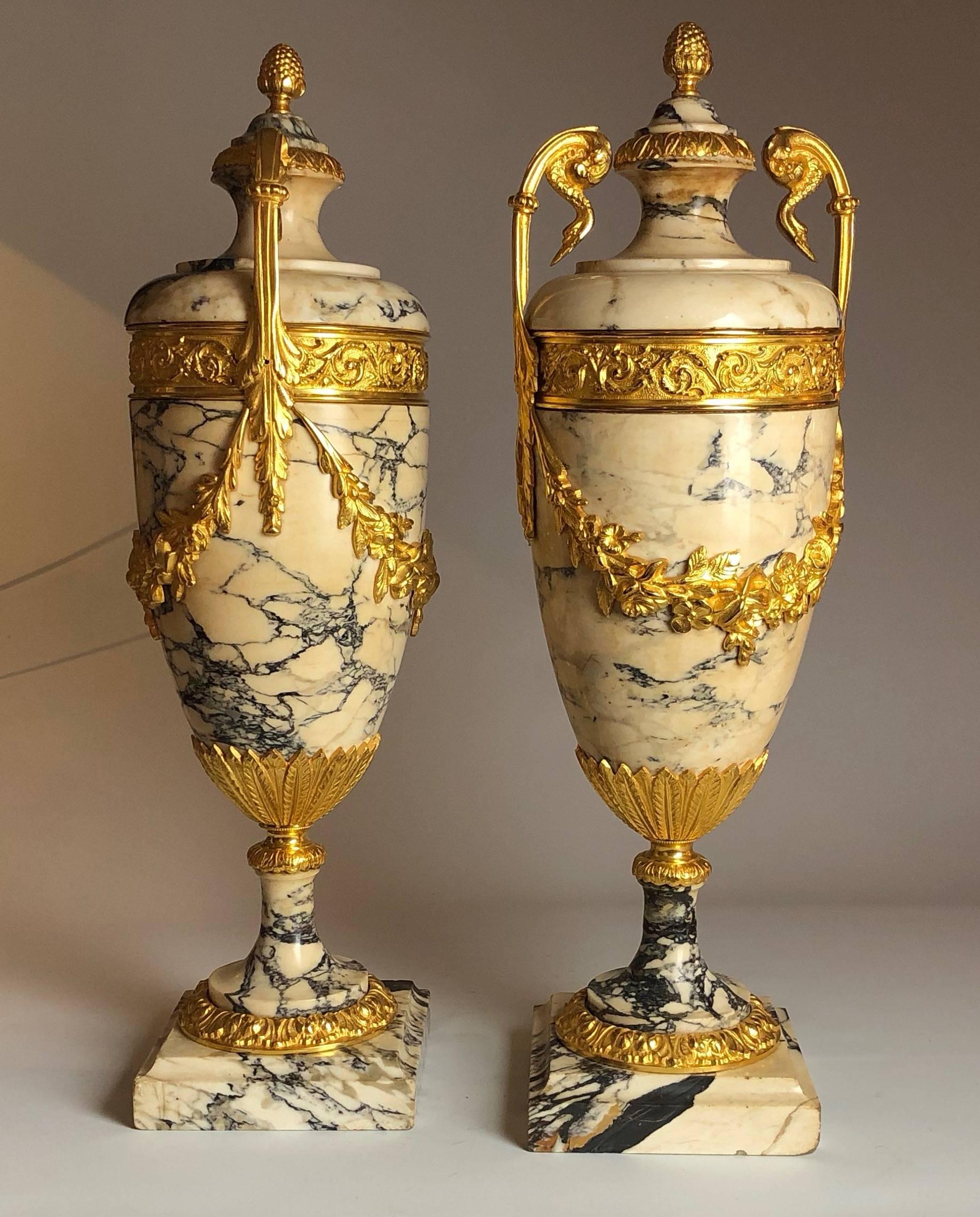 A fantastic pair of ormolu-mounted marble Urns, of the highest quality. 

French, circa 1870.

Measure: They stand 21