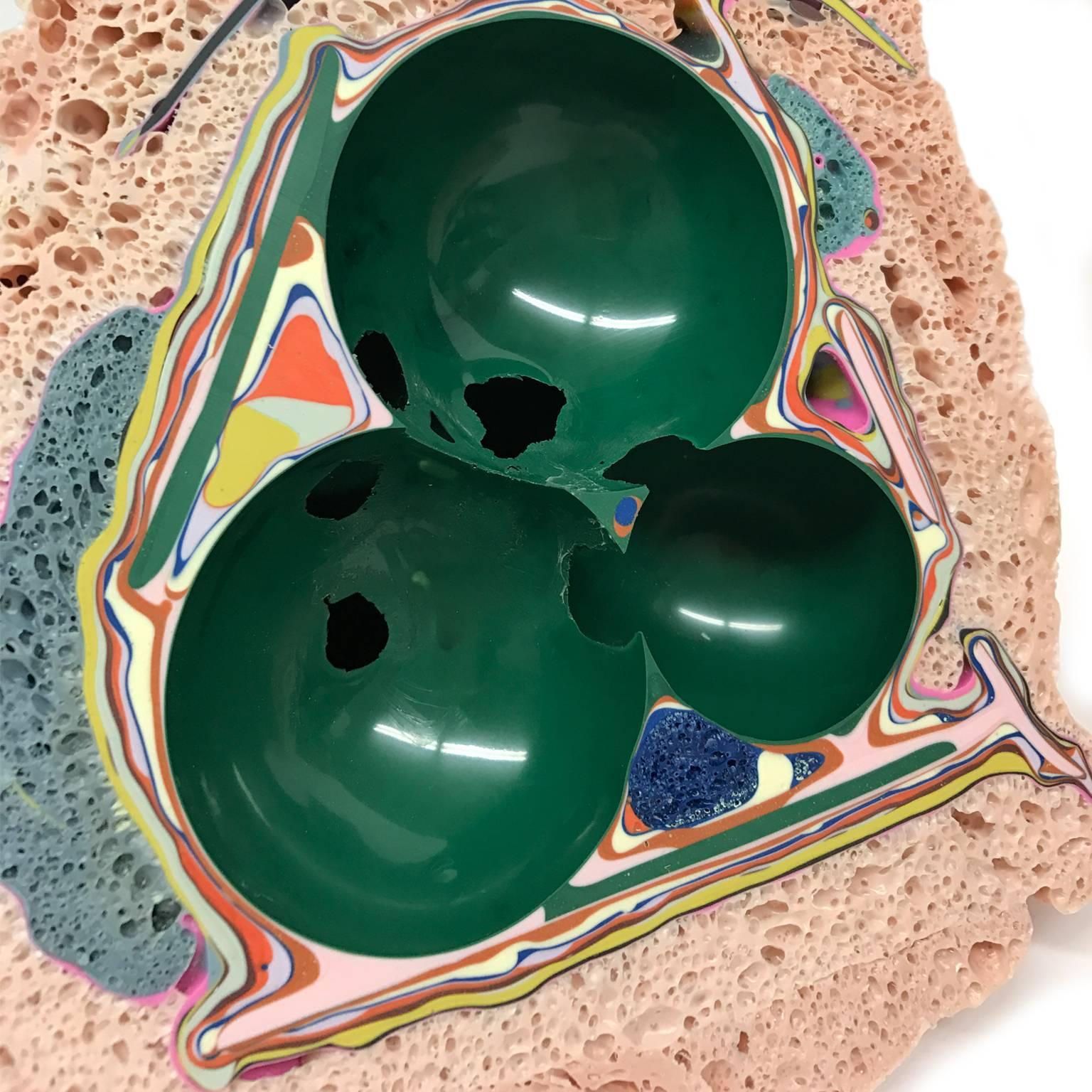 These one of a kind tabletop Geode sculptures are made by artist, Elyse Graham, in her Los Angeles studio. 

The pieces are created from the inside out. Graham forms a small cluster of breath-filled balloons then coats the shape in layer after