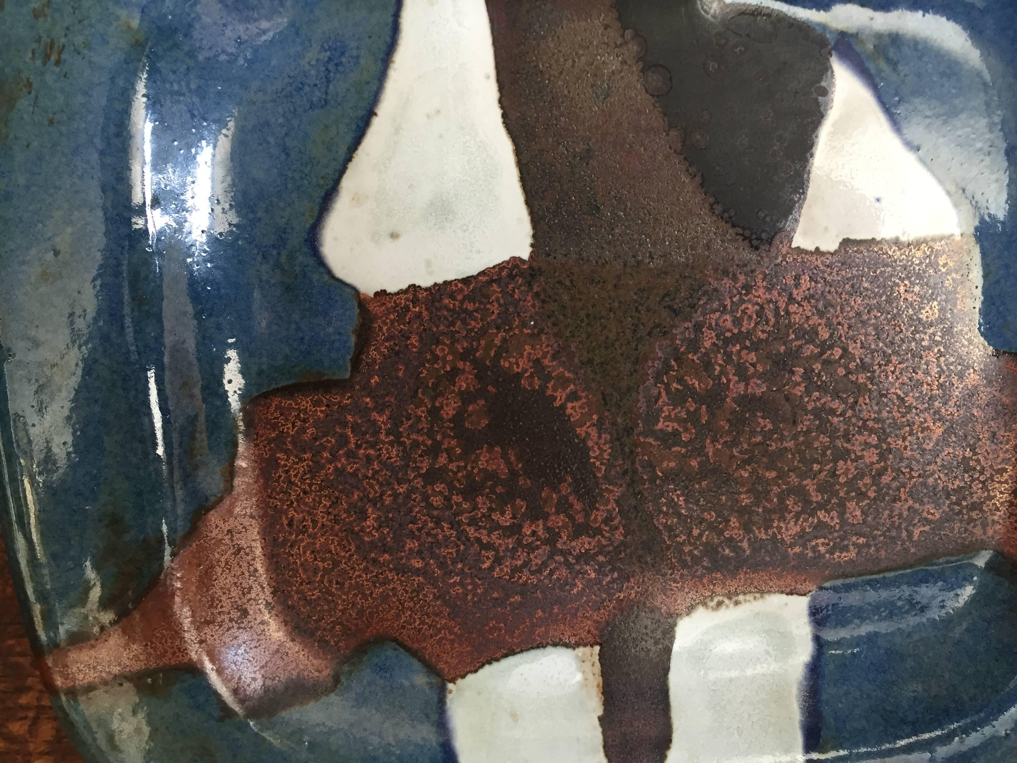 One-off art pottery rectangular dish with metallic oxide glazes. Dating to circa 1980 signed to the rear with Jacques Pouchain's monogram and signature as well as 